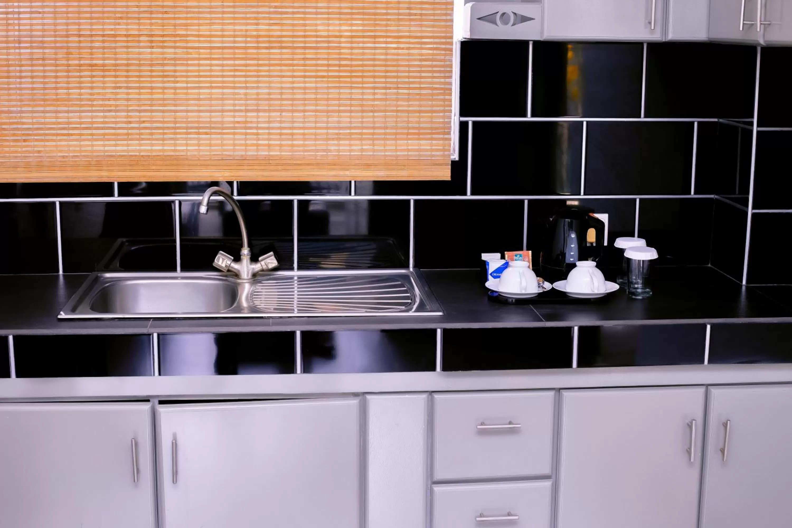 Kitchen or kitchenette in St.Lachlan Hotel & Suites