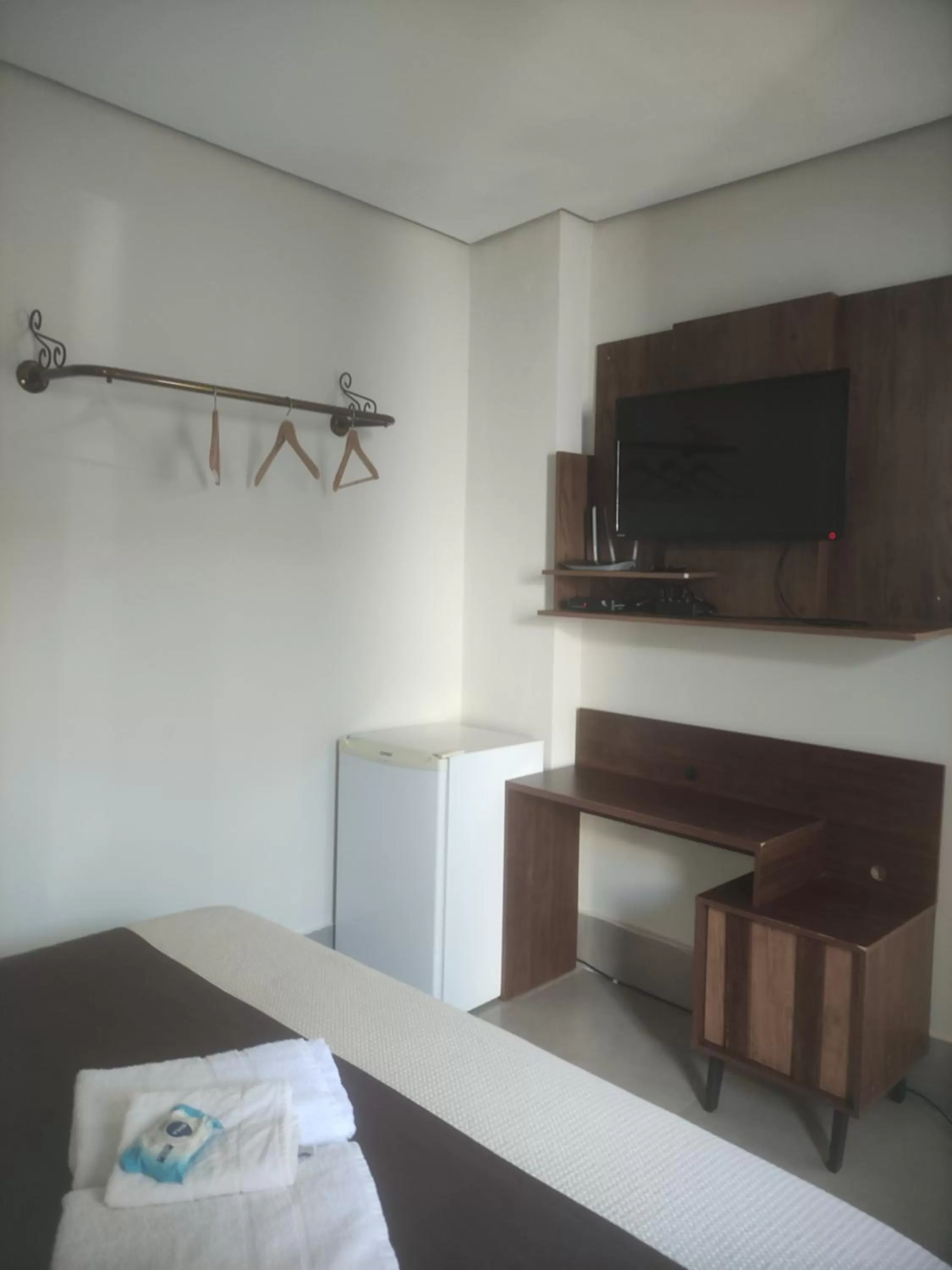 TV/Entertainment Center in Pousada da Gi Suítes e Turismo