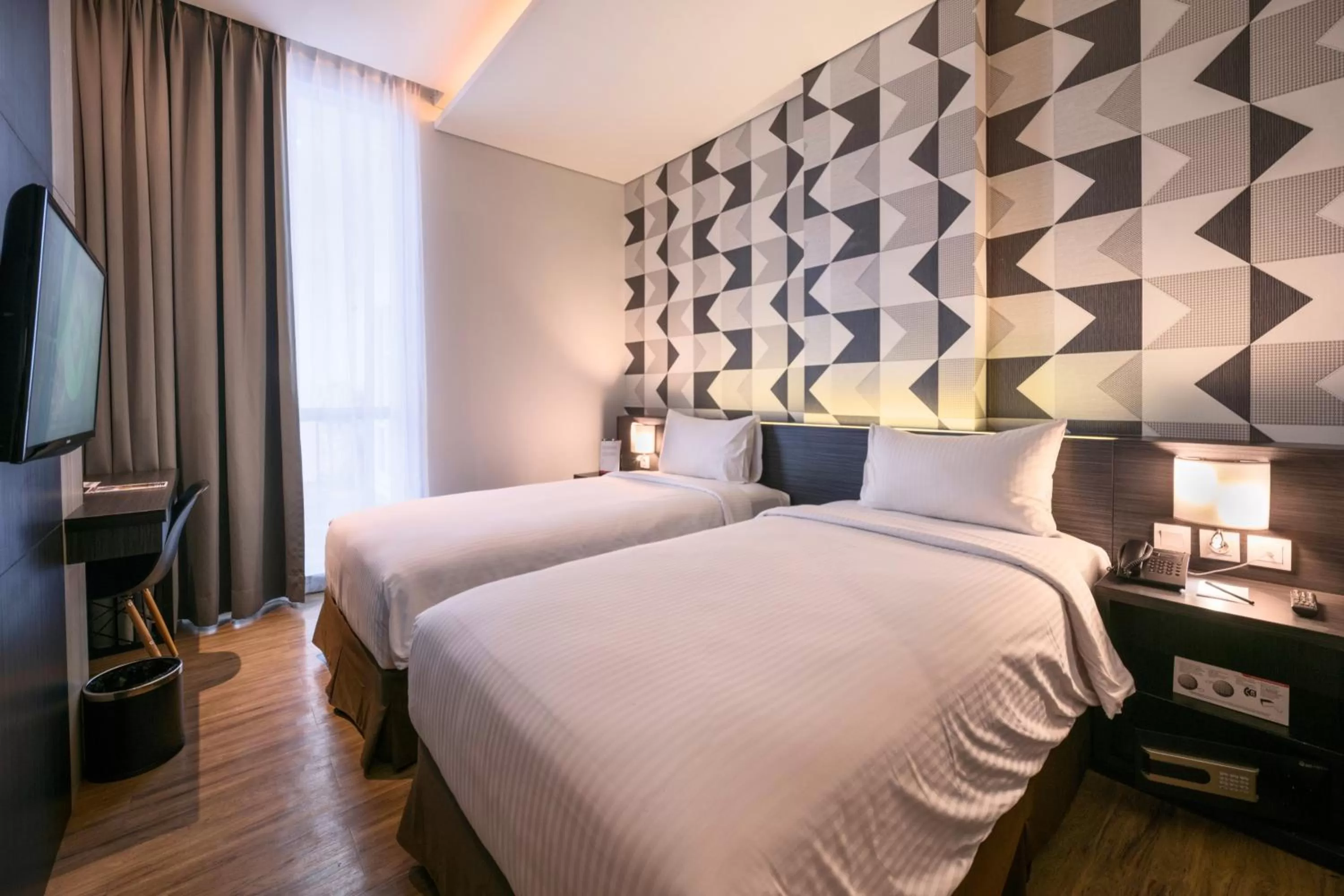 Photo of the whole room, Bed in Luminor Hotel Jemursari By WH with The Best Breakfast in Town and Located Near Surabaya Industrial Estate Rungkut SIER