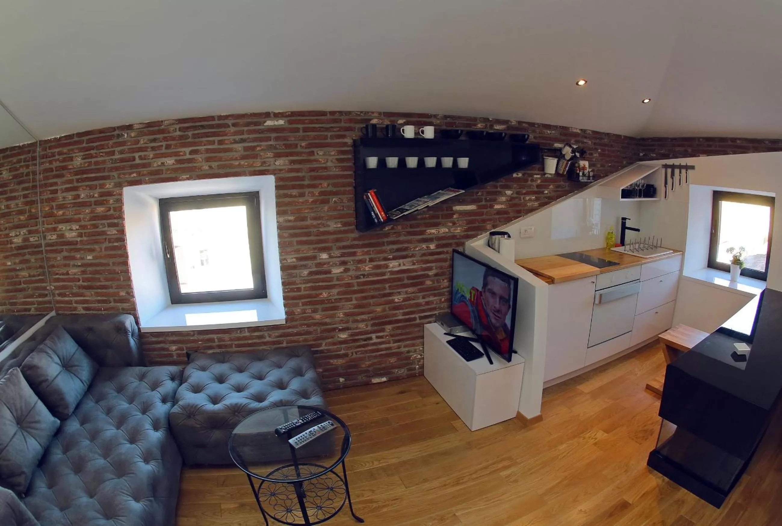 TV and multimedia in Central Apartments Integrated Hotel