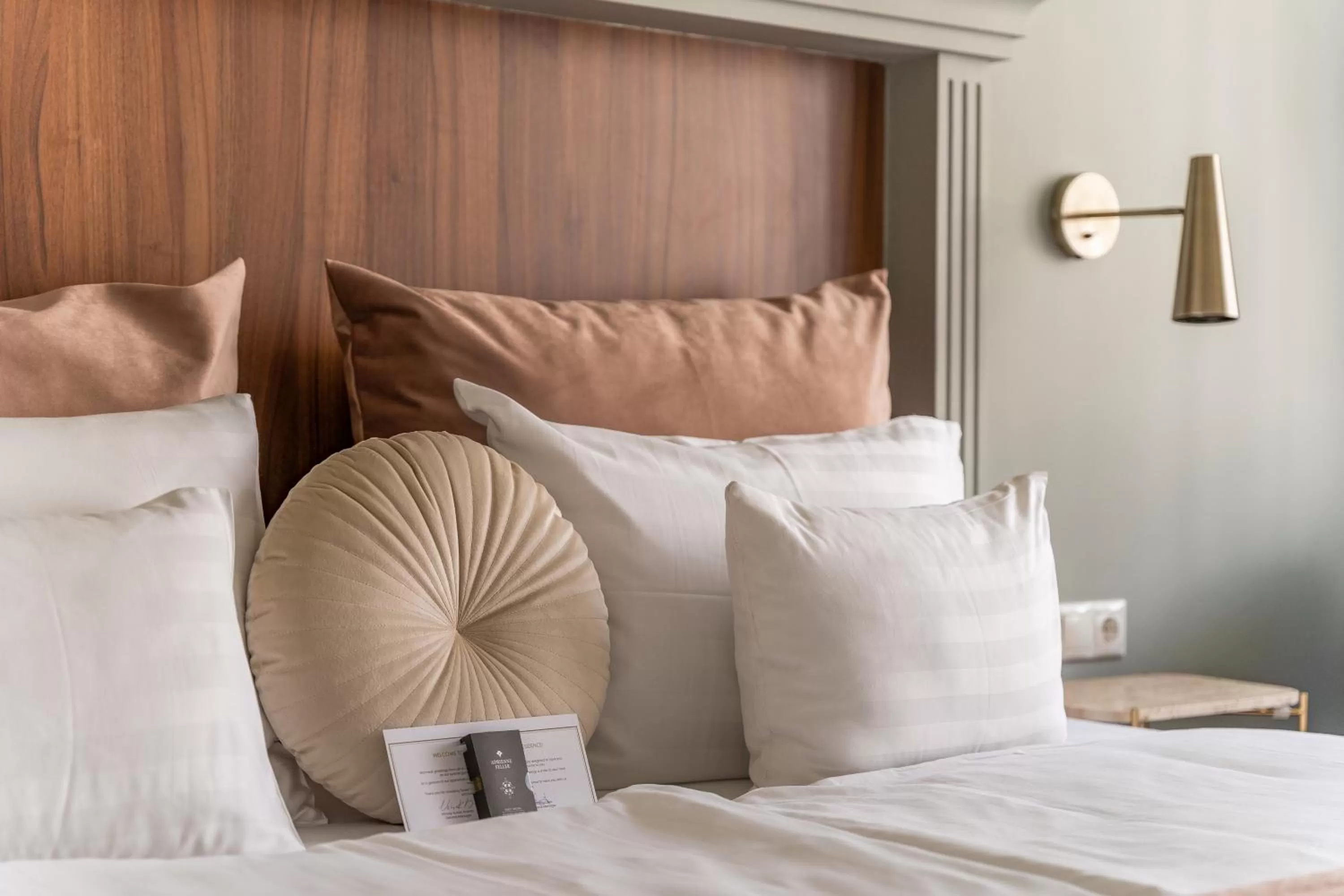 Bed in Queen's Court Hotel & Residence