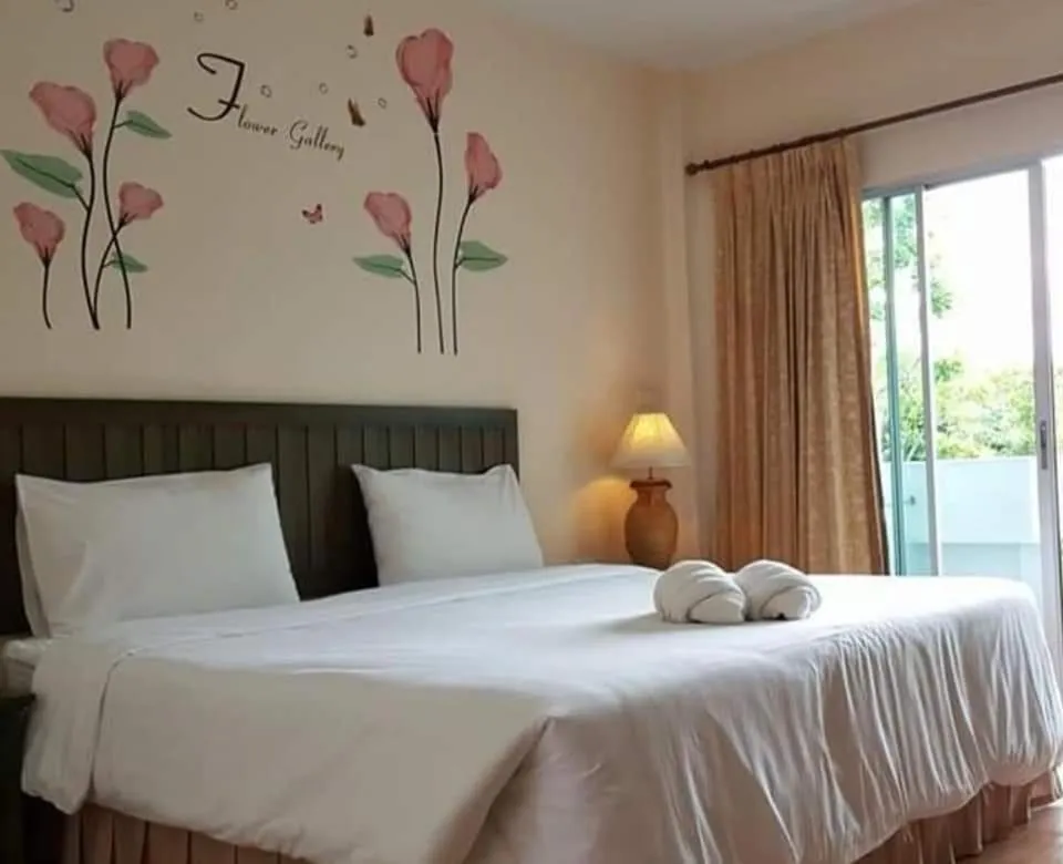 Bed in Baan Suksiri Hotel