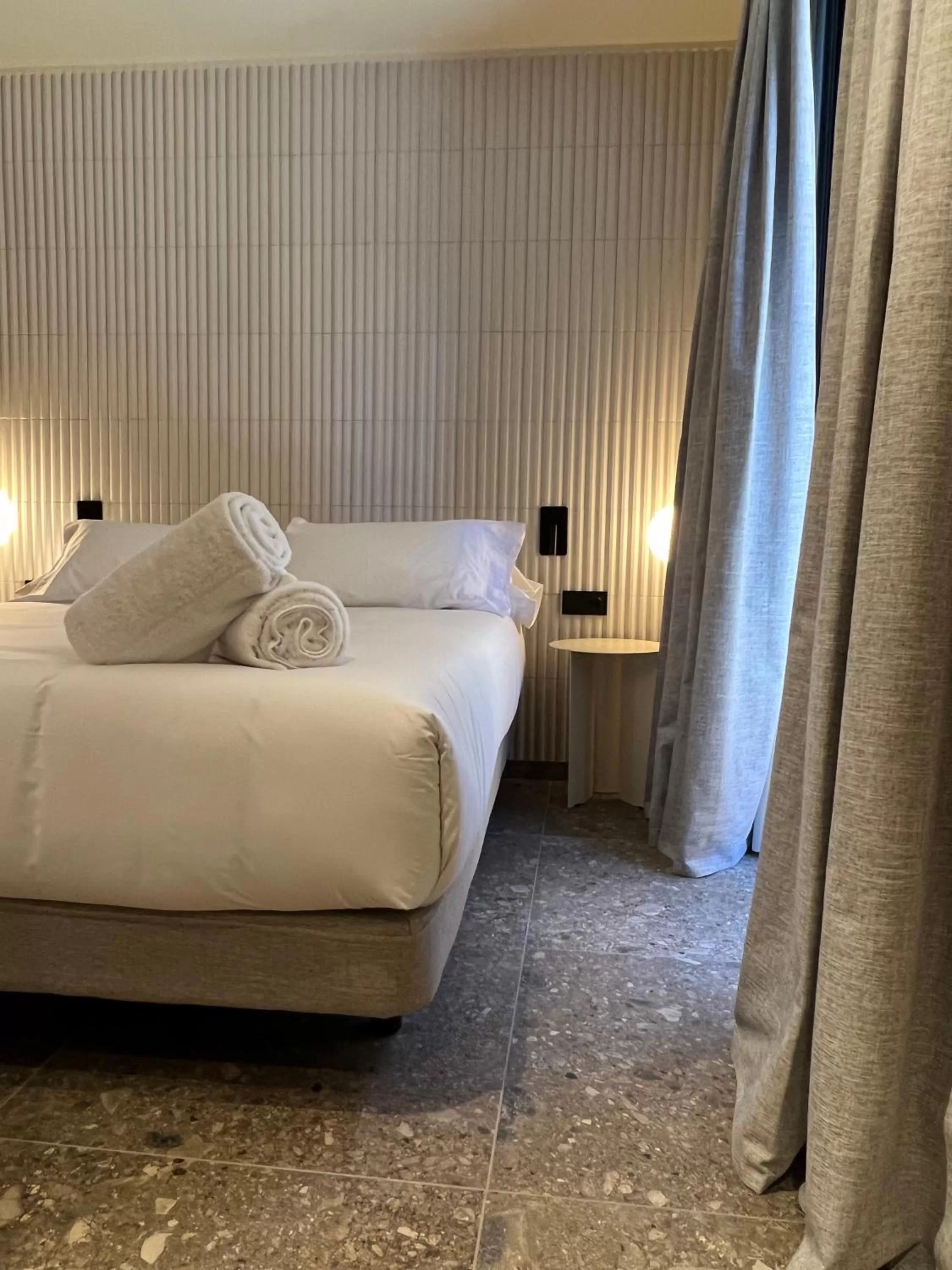 Bed in CIM HOTEL BOUTIQUE