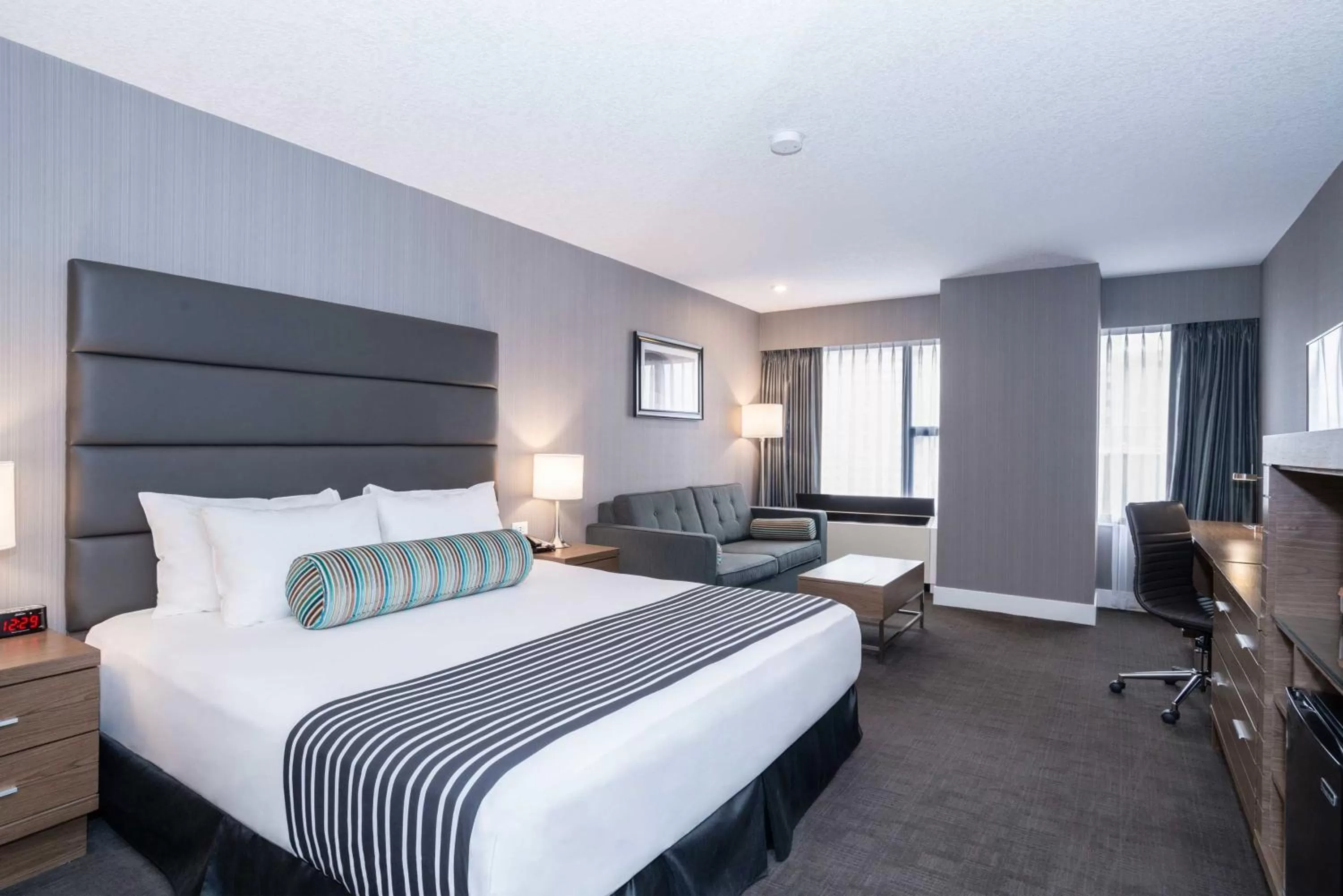 Corporate King Room with Sofa Bed in Sandman Signature Calgary Downtown Hotel