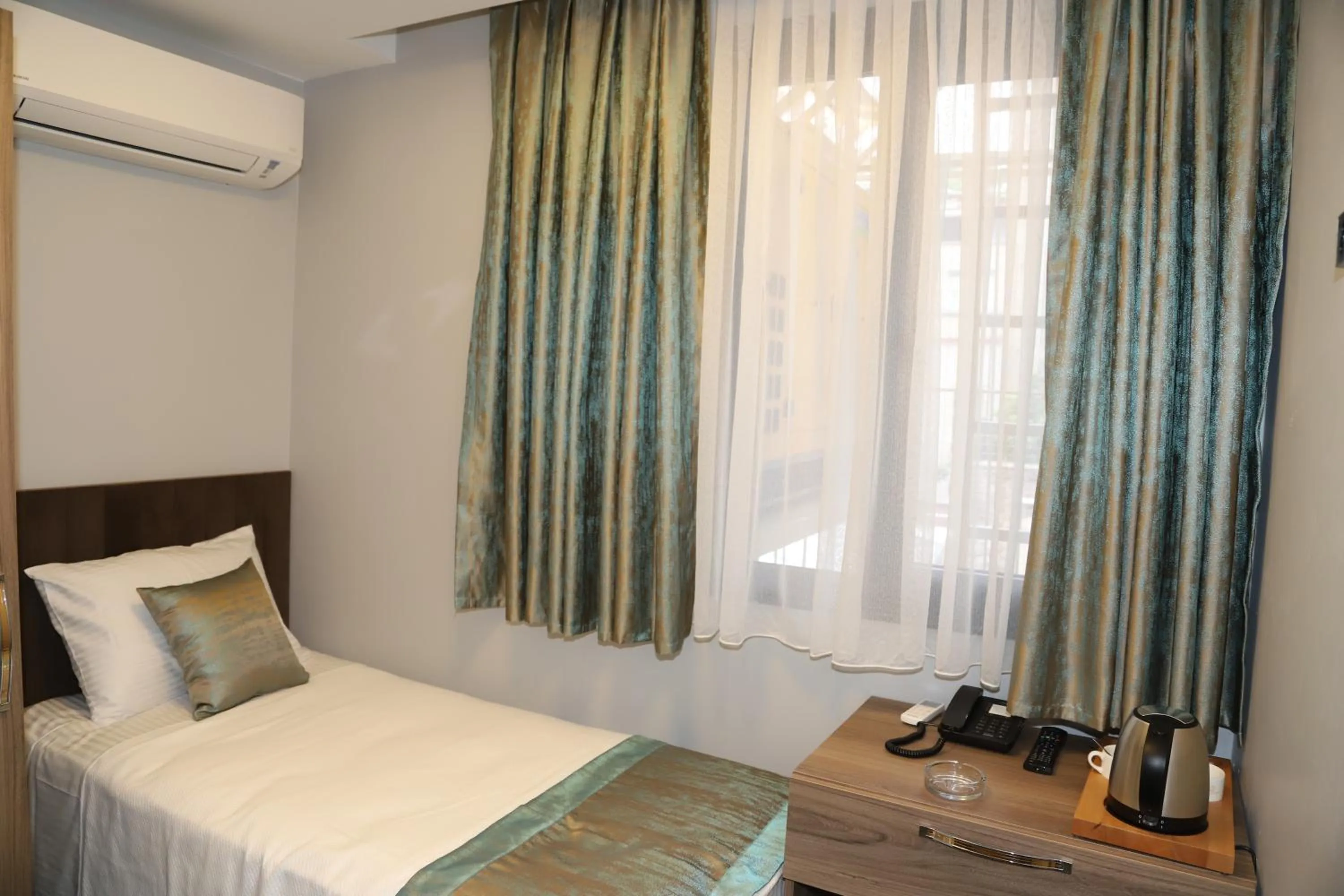 Bed in Grand Kavi Hotel