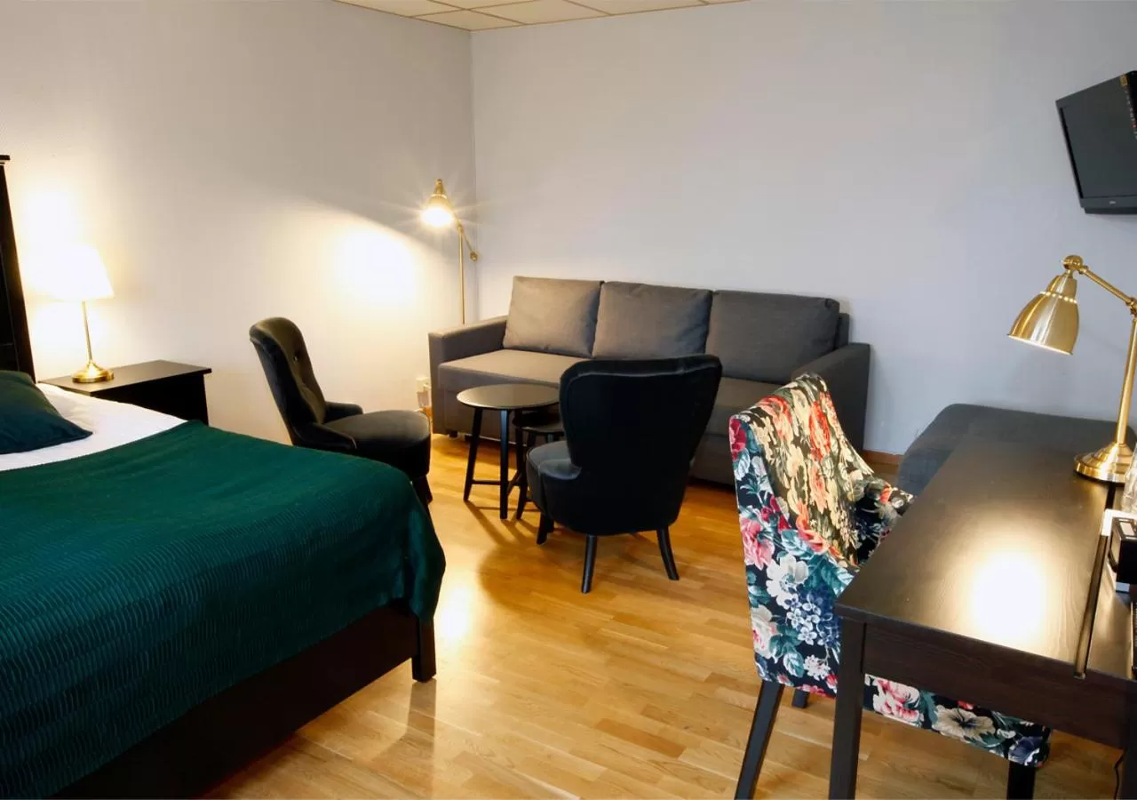 Seating area, Bed in Rasta Hallandsåsen