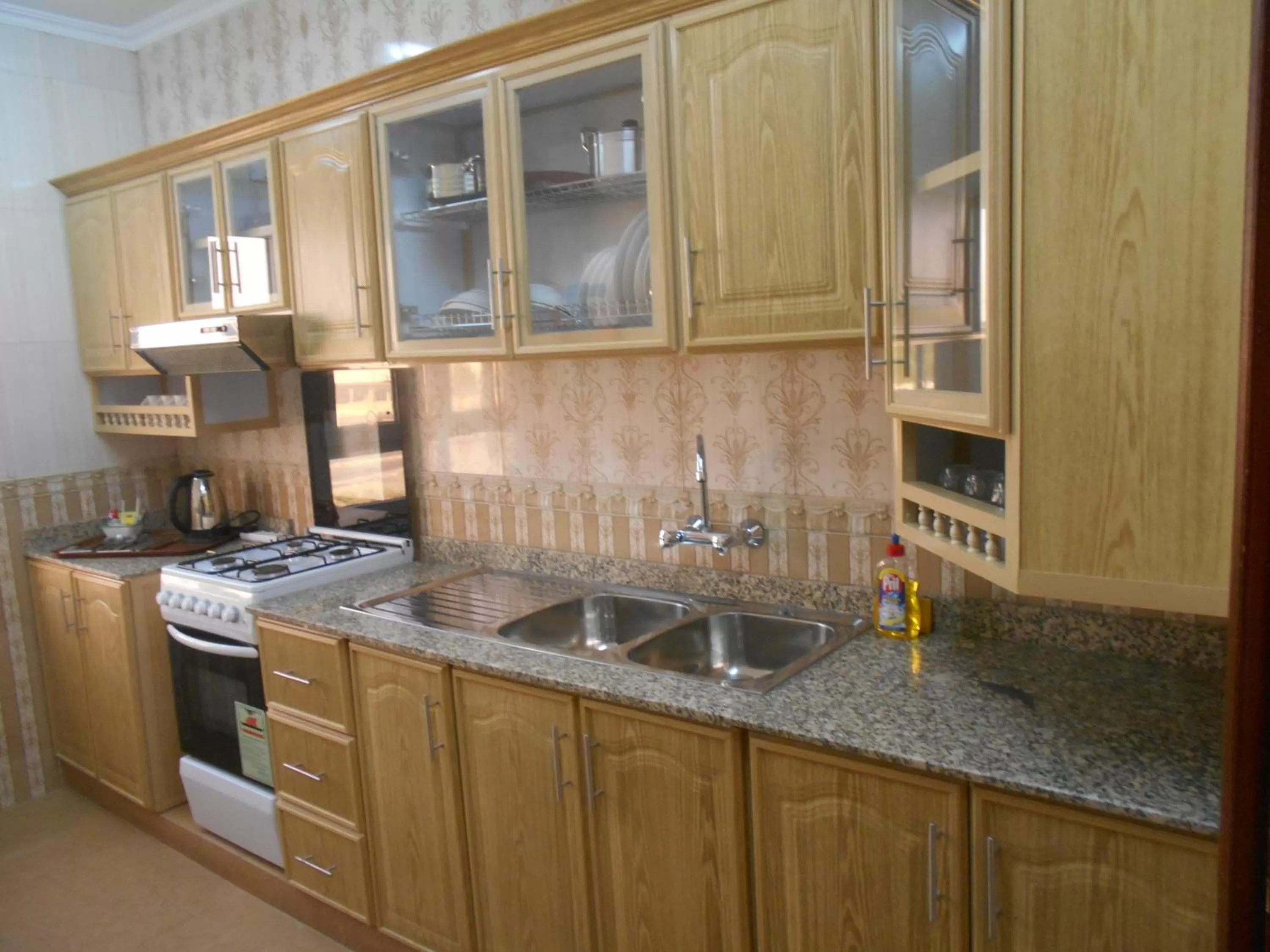 Kitchen or kitchenette in Nizwa Hotel Apartments