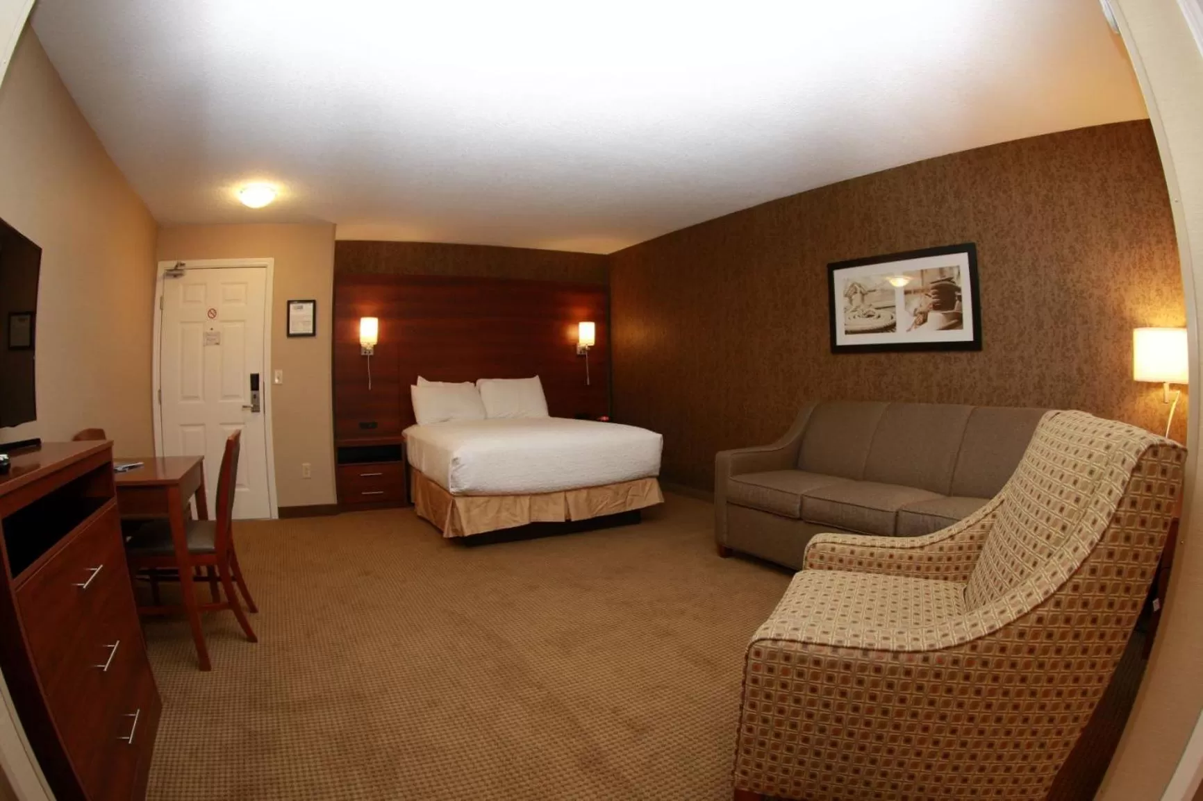 Bed in Budget Host Inn & Suites