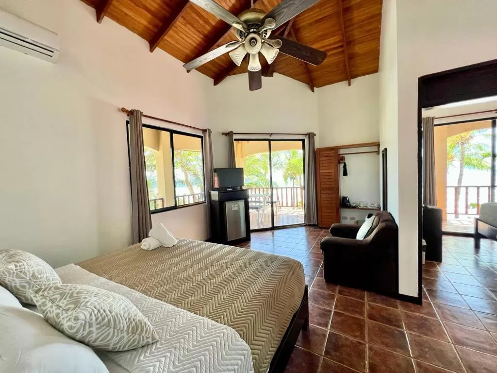 Living room, Bed in The Backyard Beachfront Hotel