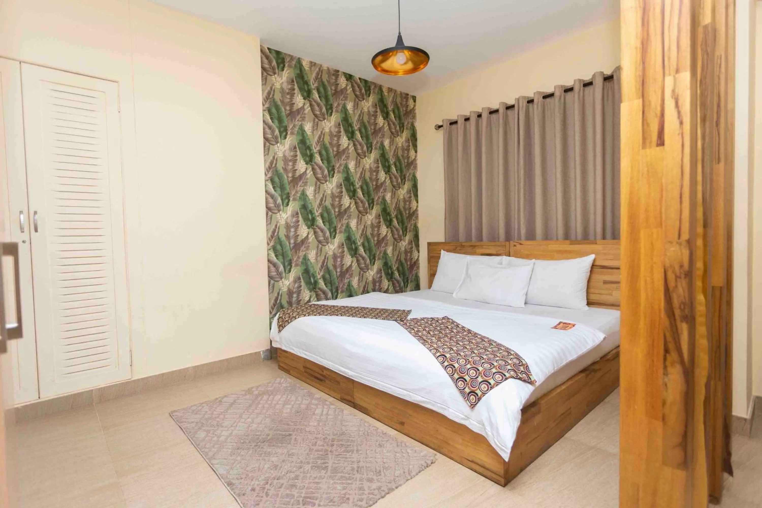 Bed in Roots Hotel Apartment