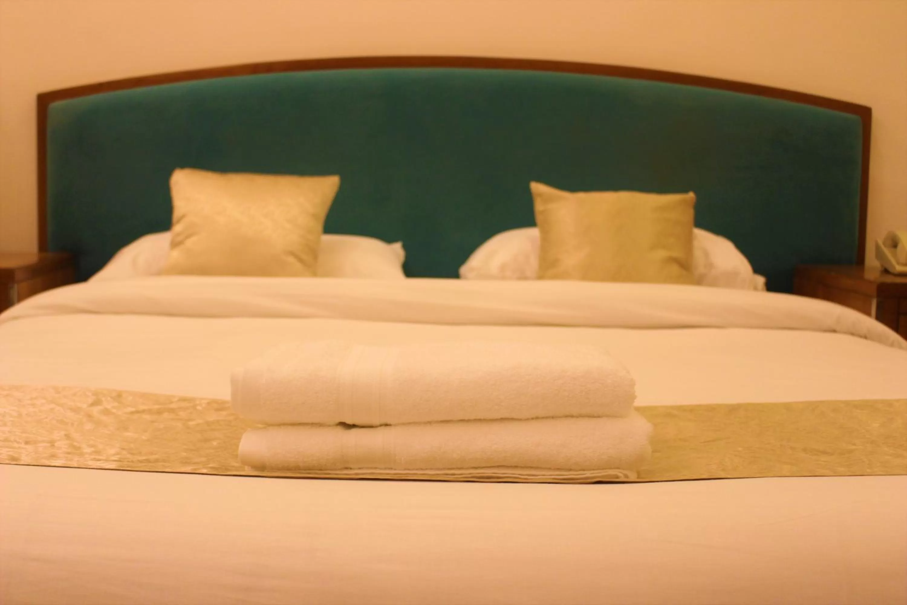 Bed in New MerryLand Hotel