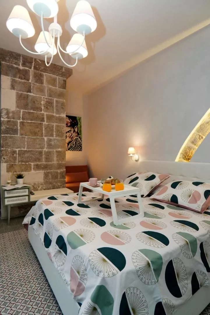 Bed in Cecenero Rooms