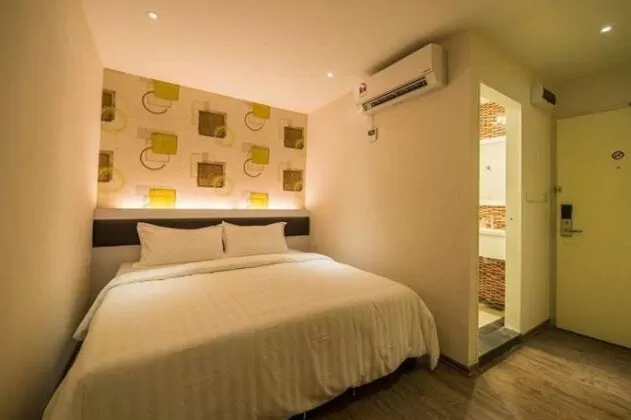 Bed in Riverfront Boutique Hotel