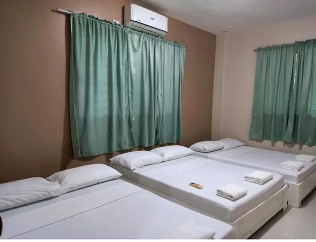Bed in Sandscape Hotel
