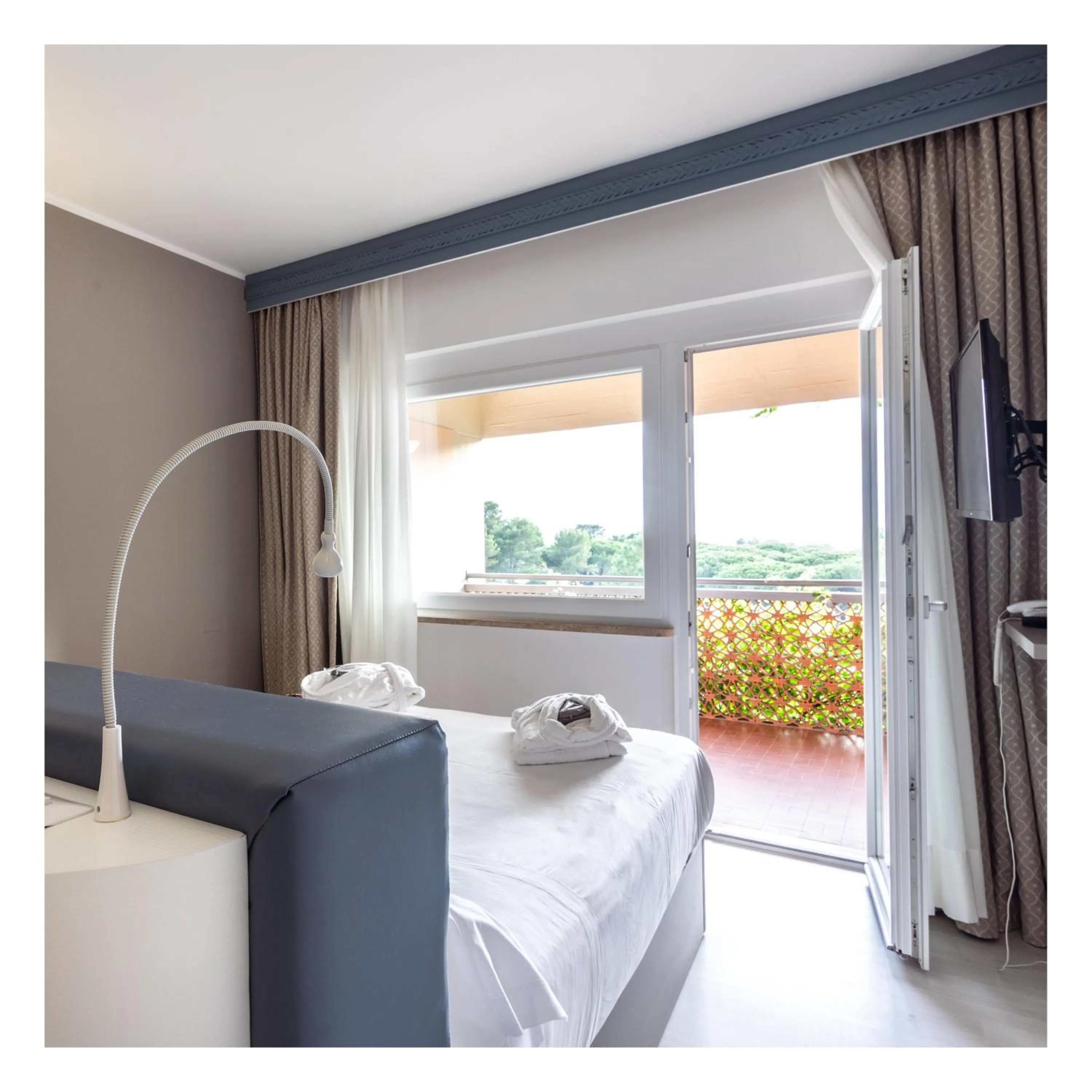 View (from property/room), Bed in Golf Hotel Punta Ala