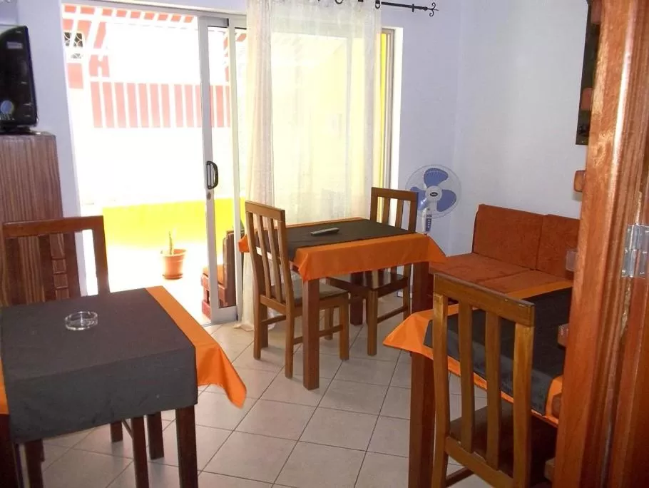 Communal lounge/ TV room, Restaurant/Places to Eat in Basic Hotel