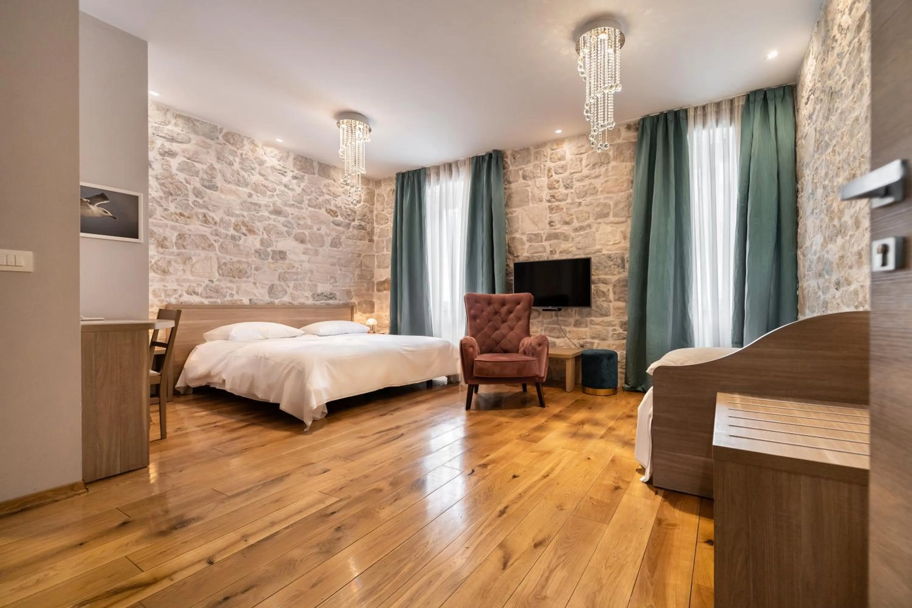 Bed in Tifani Luxury Rooms