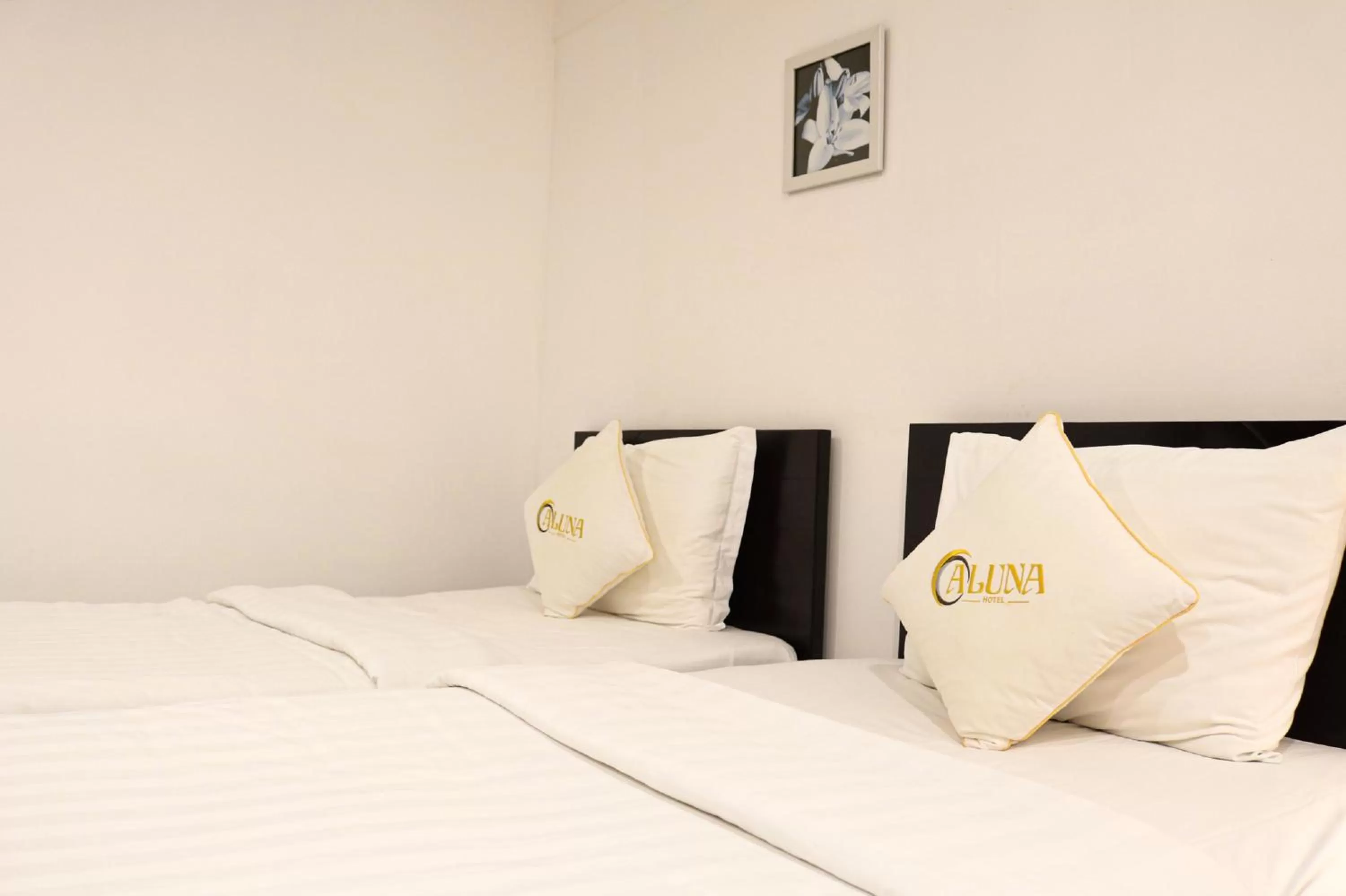 Bed in ALUNA Ben Thanh Hotel