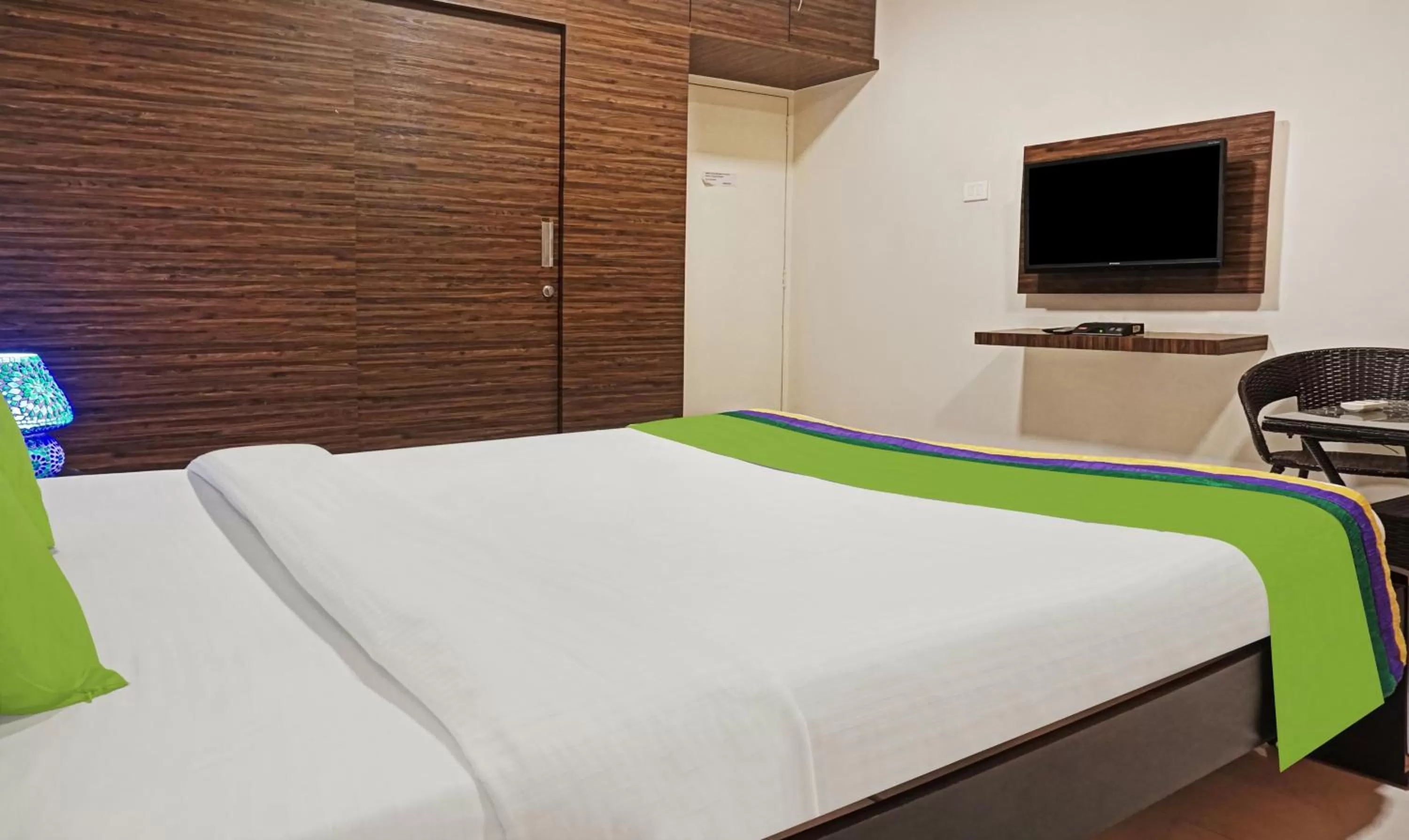 Bedroom, Bed in Treebo Excellent Home