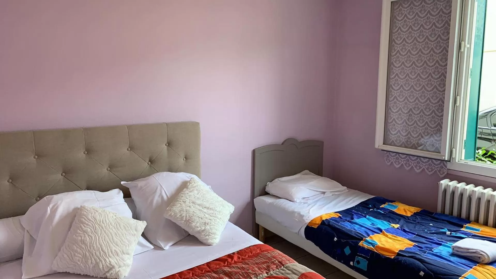 Bed in HOTEL DU CYGNE DE LA CROIX BLANCHE