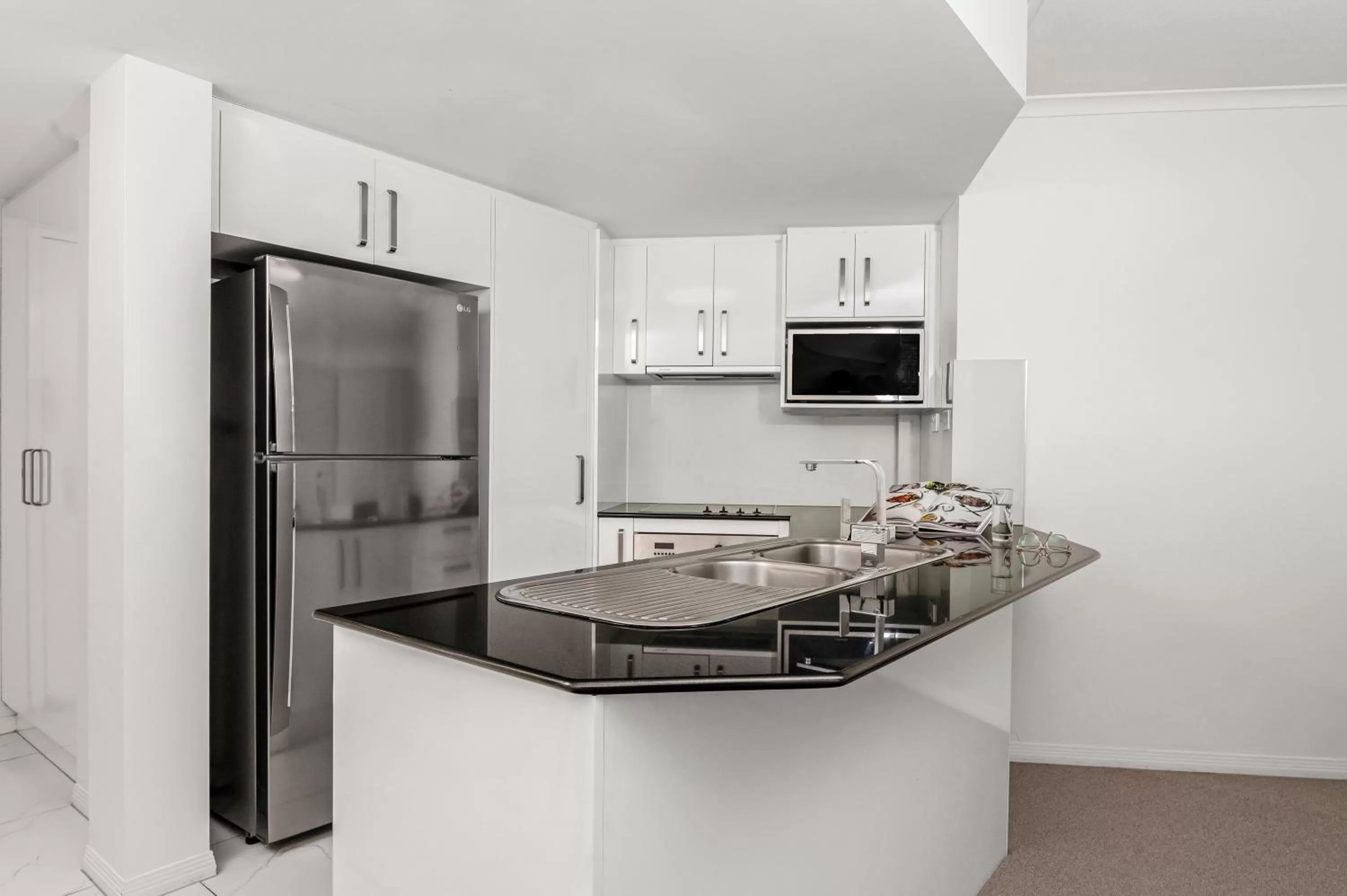 Kitchen or kitchenette in Mantra Coolangatta Beach