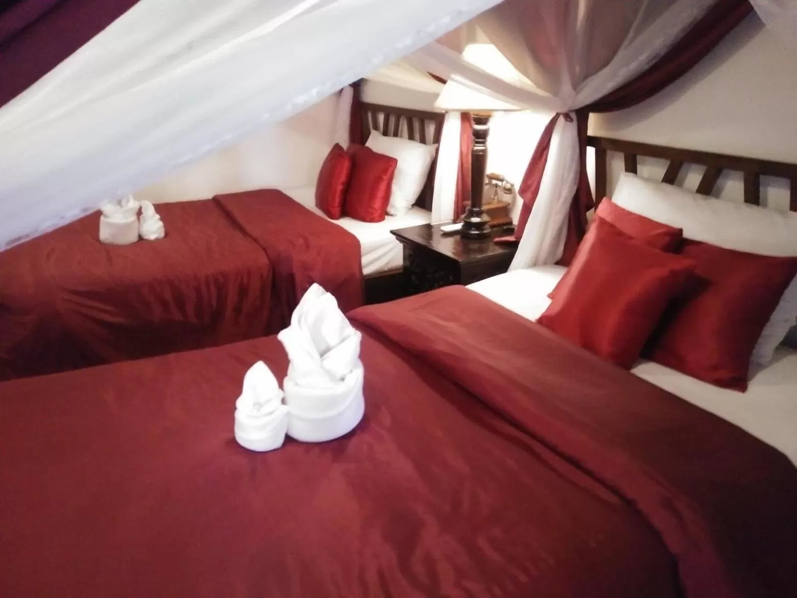 Bed in Tri Yaan Na Ros Colonial House