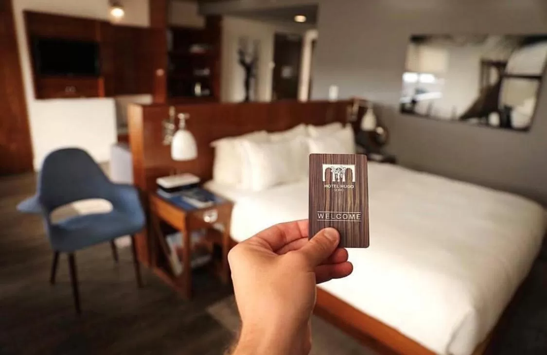 Property logo or sign, Bed in Hotel Hugo