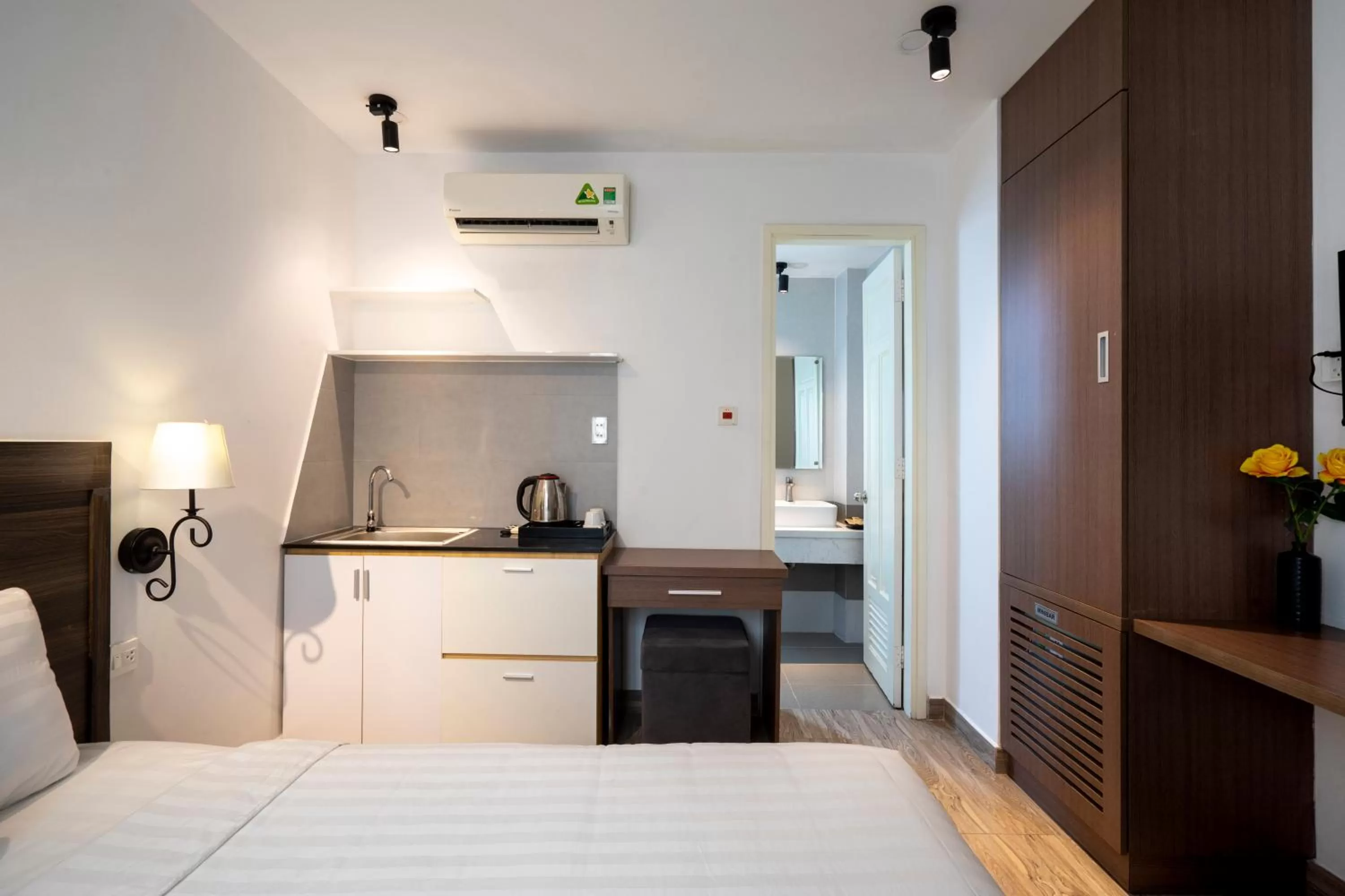 Kitchen or kitchenette, Bed in La Airport Tan Binh Hotel