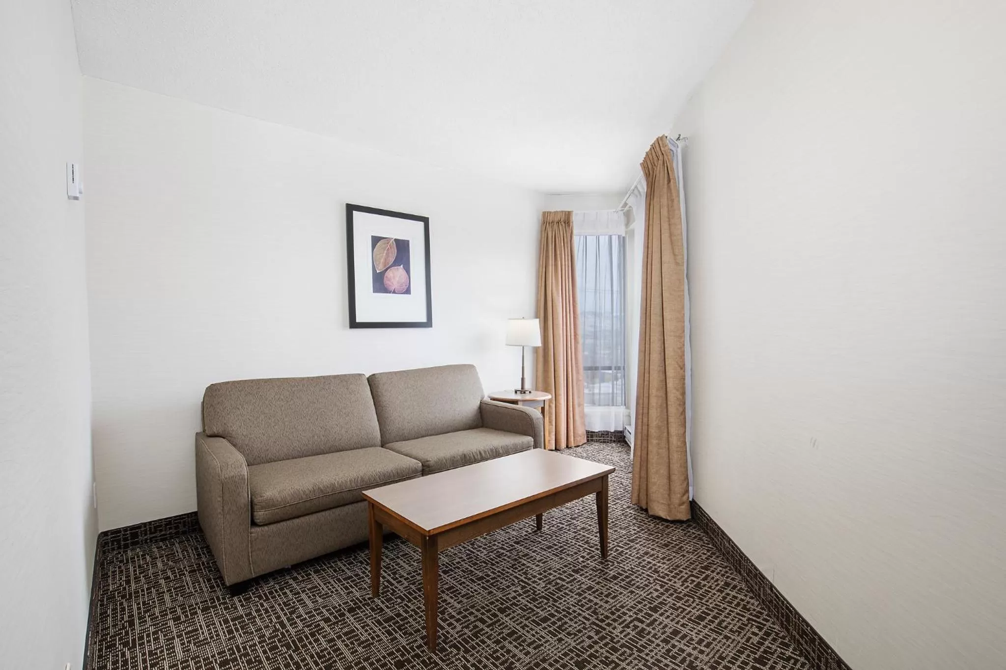 Living room in Ramada by Wyndham Kamloops