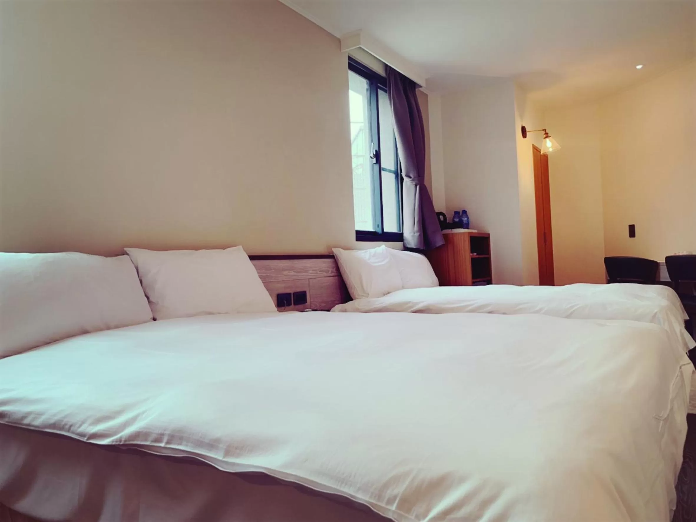 Bed in Raise Hotel Taichung