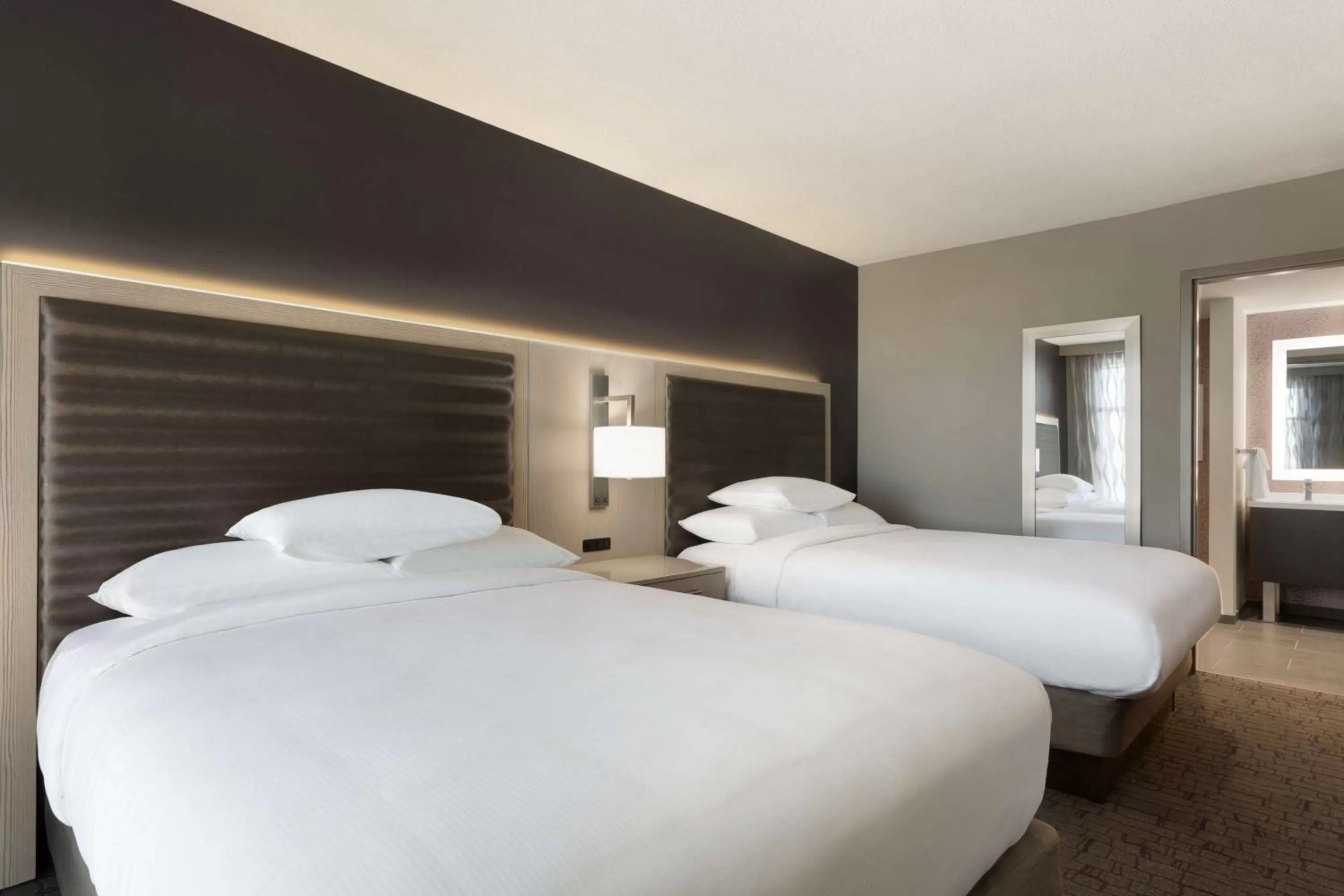 Bed in Embassy Suites by Hilton Charlotte Uptown