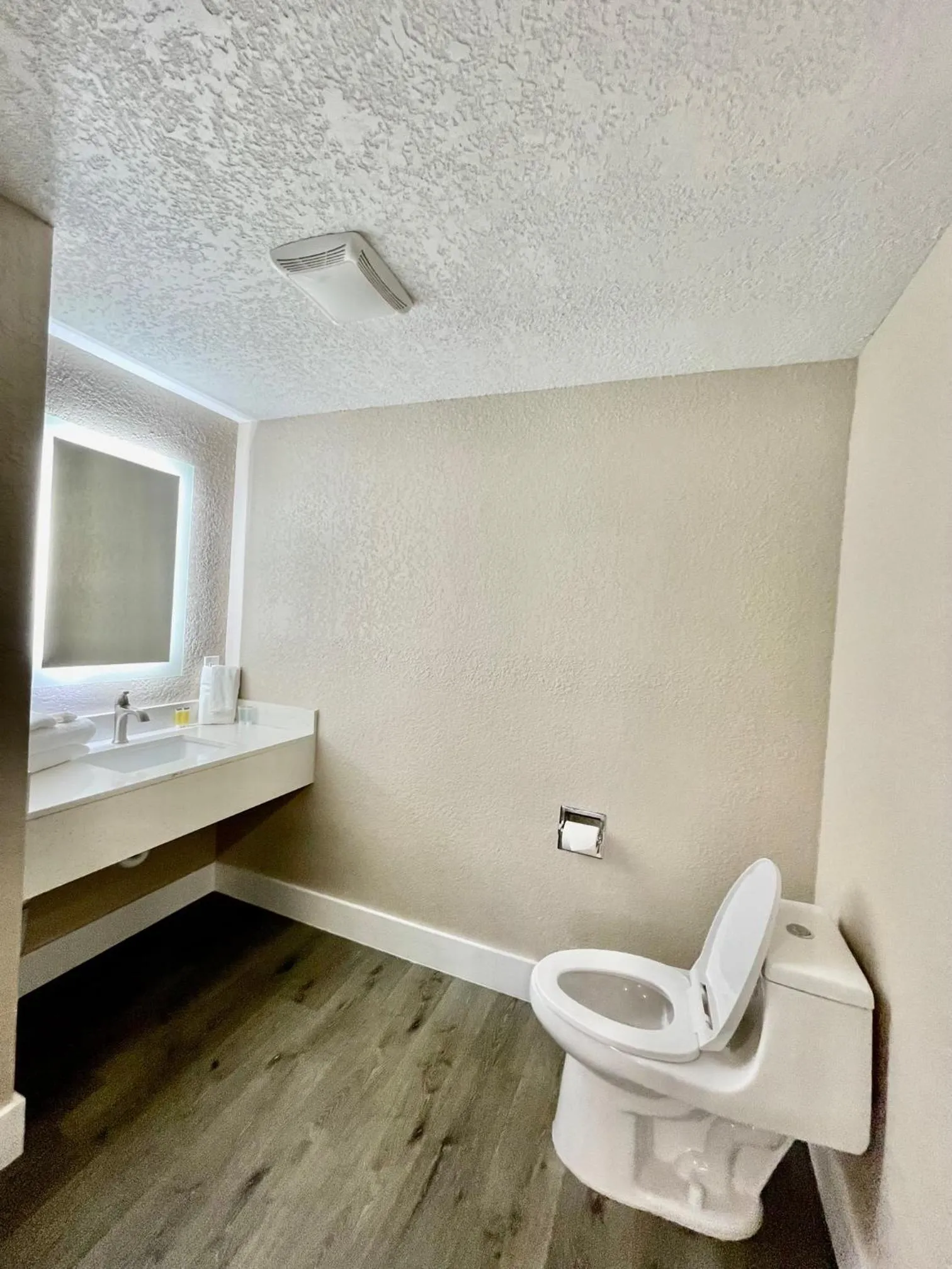 Toilet in Super 8 by Wyndham Kissimmee-Orlando