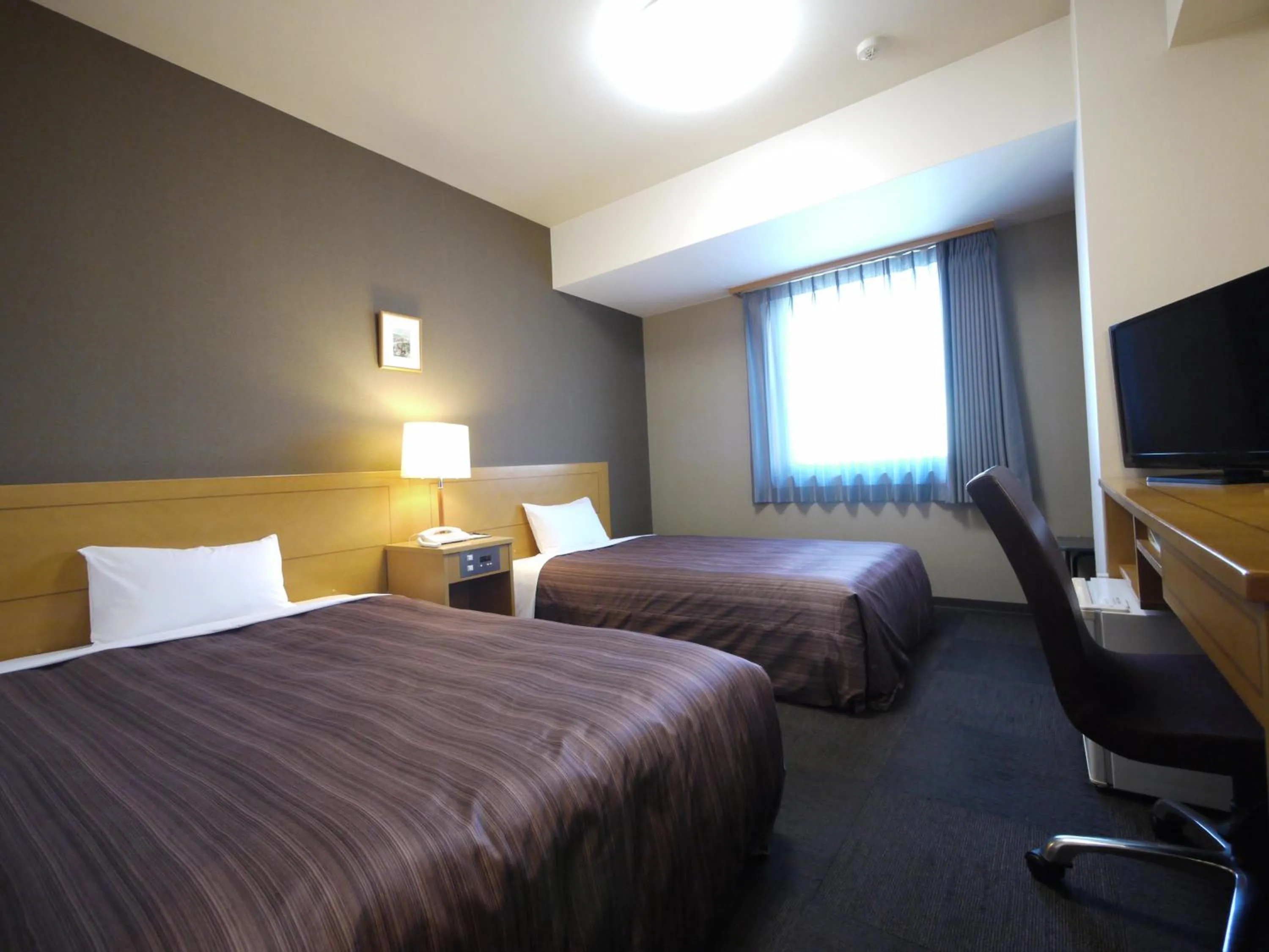 Photo of the whole room, Bed in Hotel Route-Inn Obihiro Ekimae