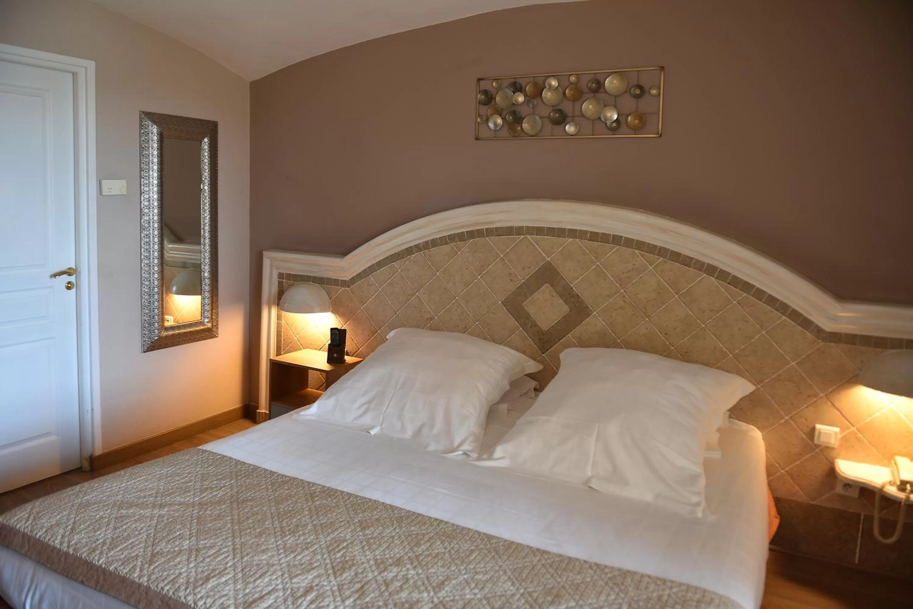 Bed in Ostella Spa & Resort