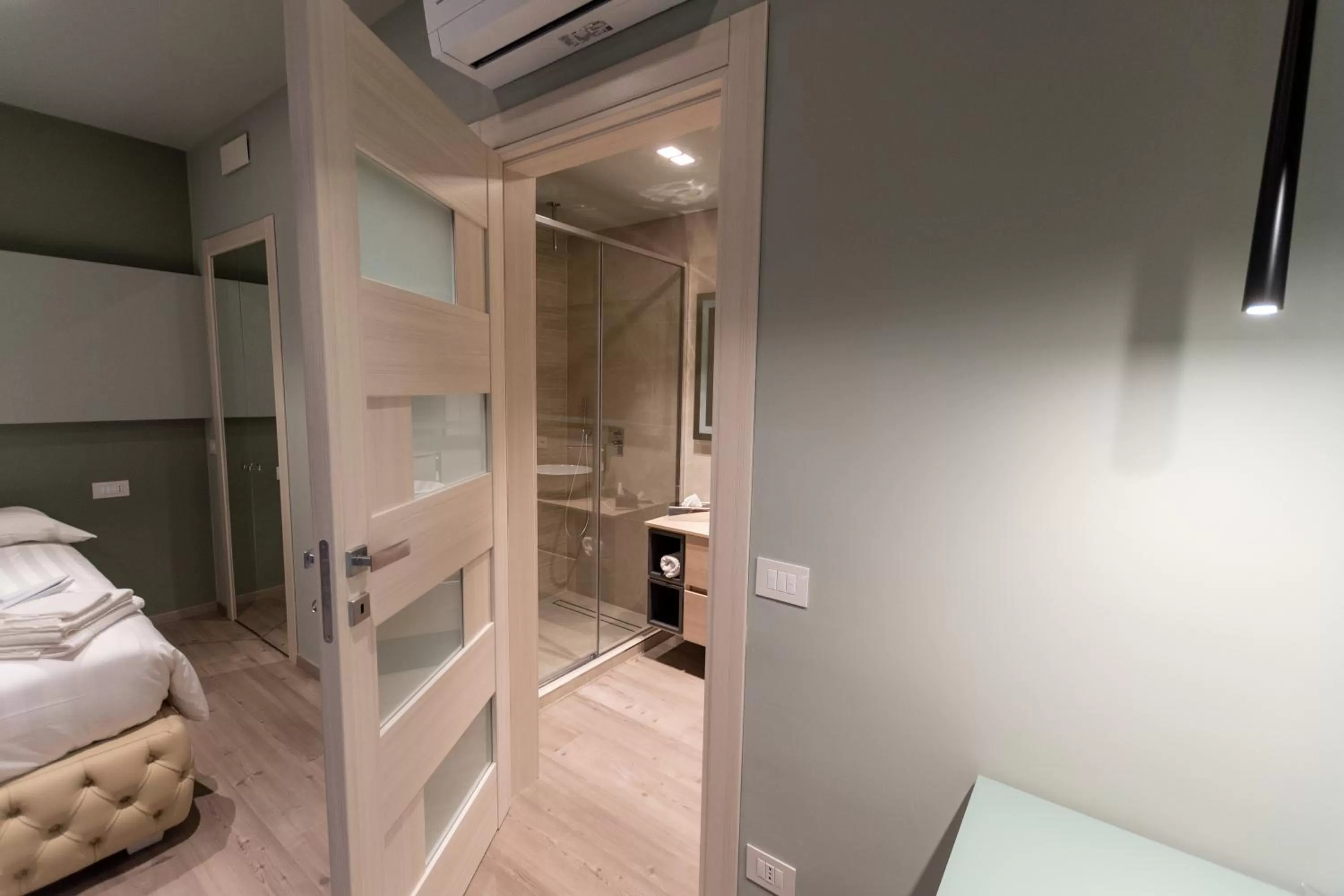 Bed in DiVino Rooms Deluxe