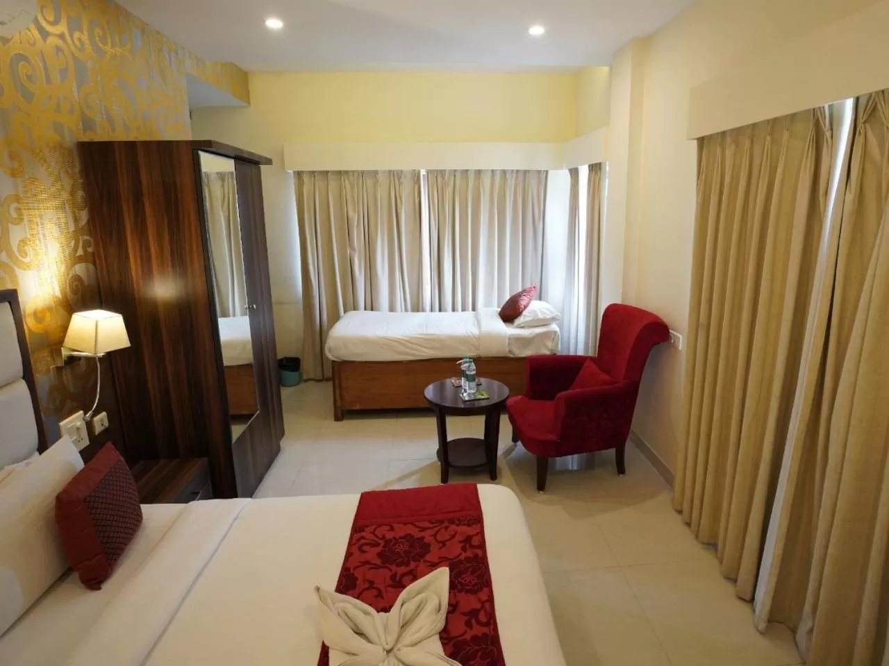 Photo of the whole room, Bed in Indira Nikunj Rubystone Exotic