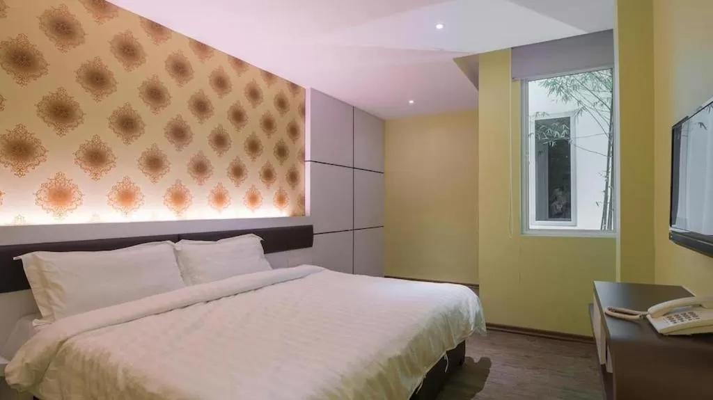 Bed in Riverfront Boutique Hotel