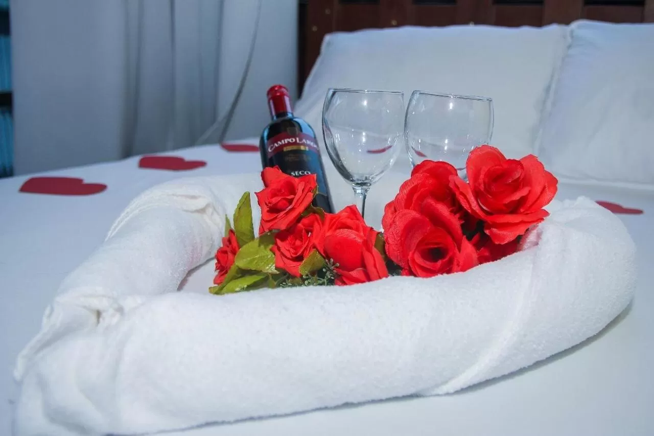 Bed in Pousada Quatro Estrelas