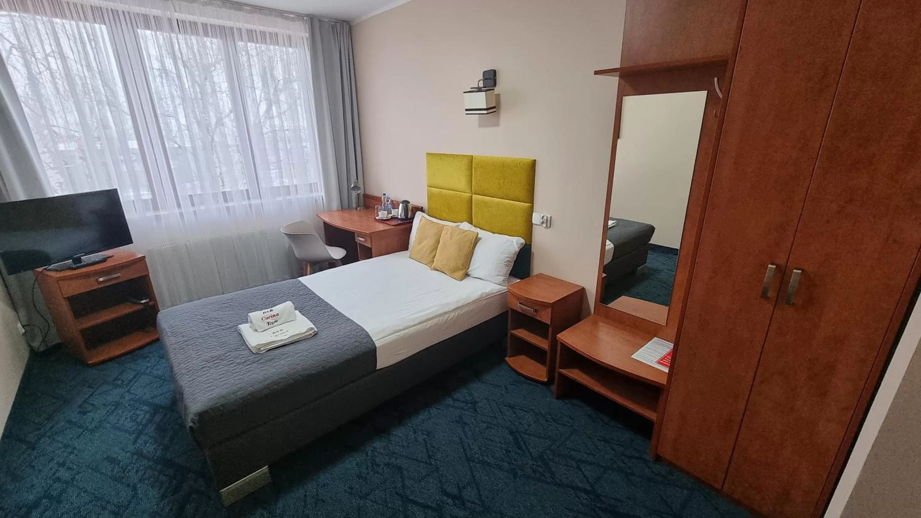 Photo of the whole room, Bed in Carina Hotel