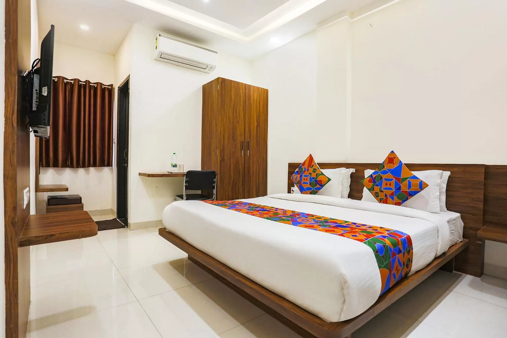 Bed in FabHotel Balaji Paradise