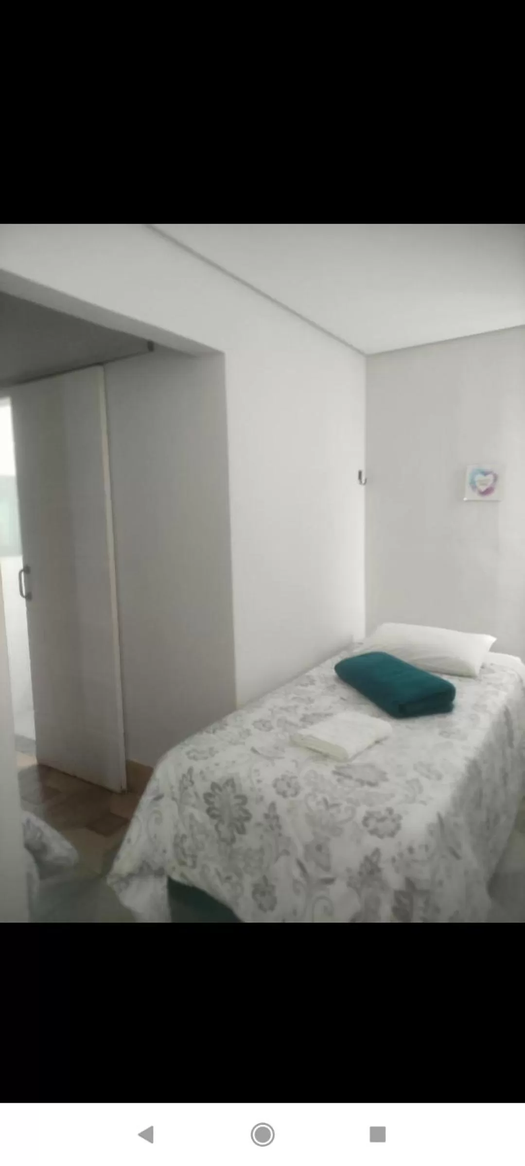 Bed in Pousada da Gi Suítes e Turismo