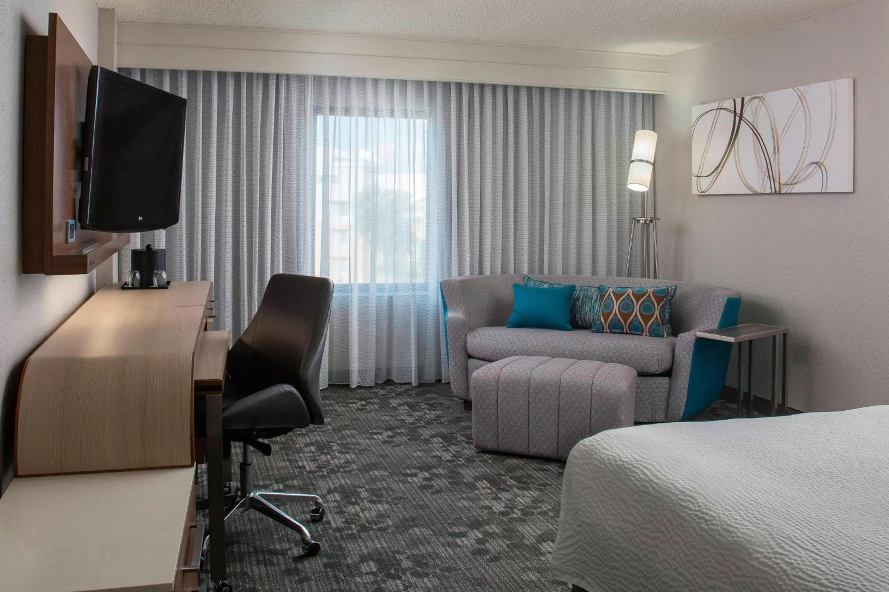 King Room with Sofa Bed and Roll-in Shower - Mobility and Hearing Accessible in Courtyard by Marriott Orlando Lake Buena Vista in the Marriott Village