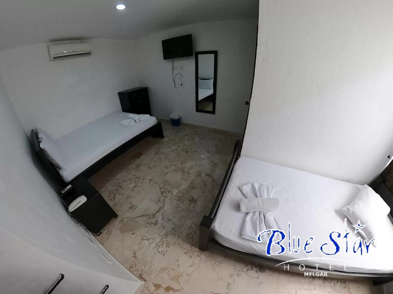 Bed in Blue Star Hotel