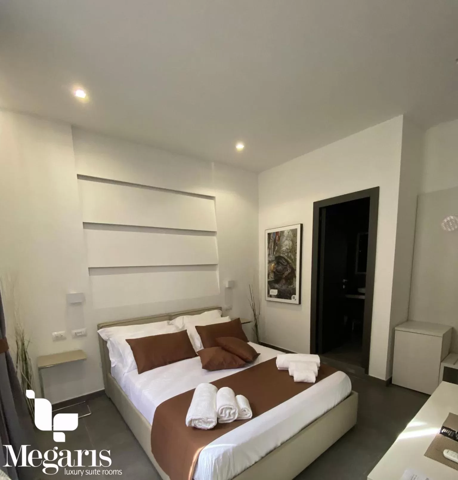 Bed in Megaris Luxury Suite Rooms