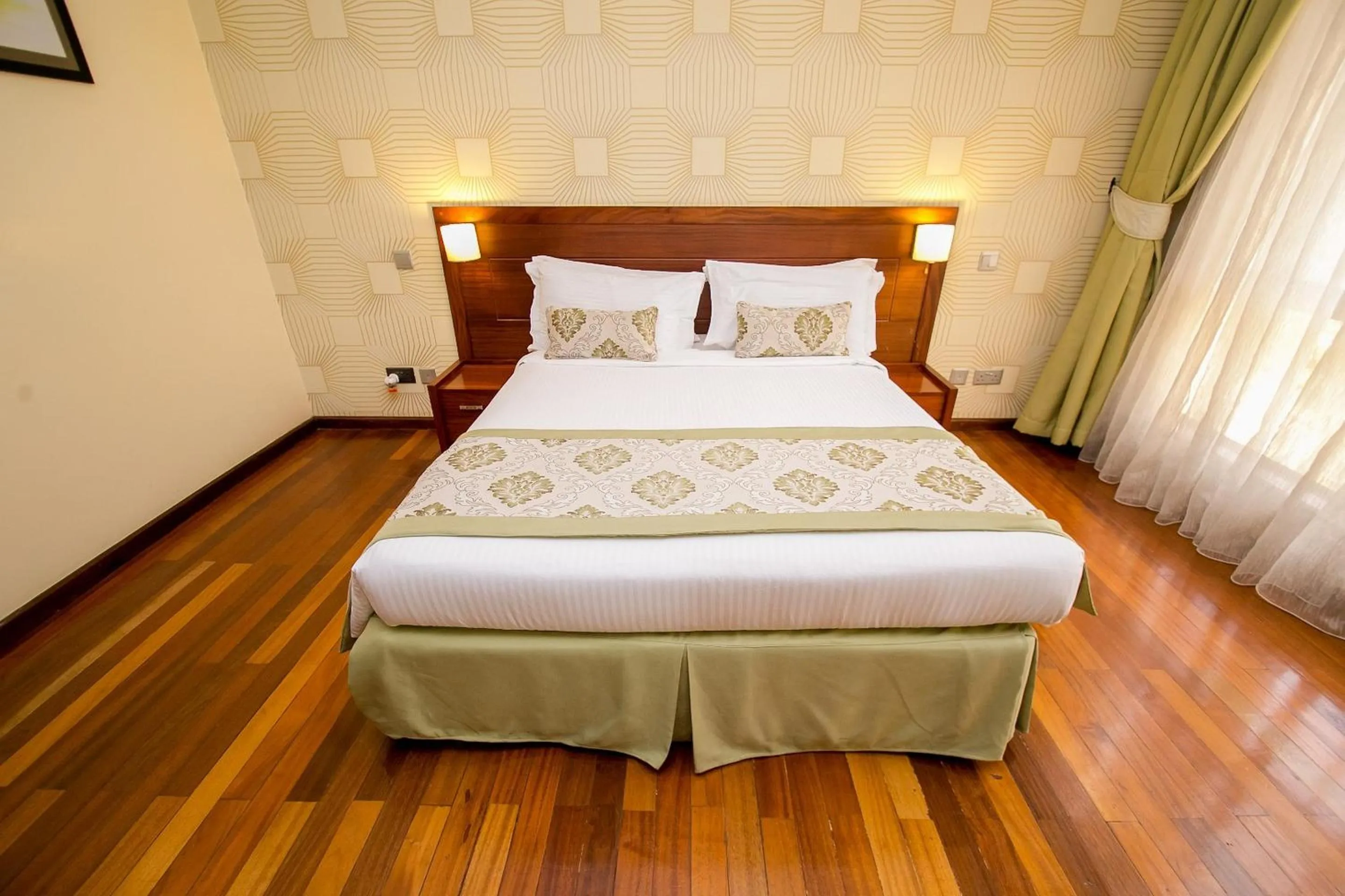 Photo of the whole room, Bed in Waridi Paradise Hotel and Suites