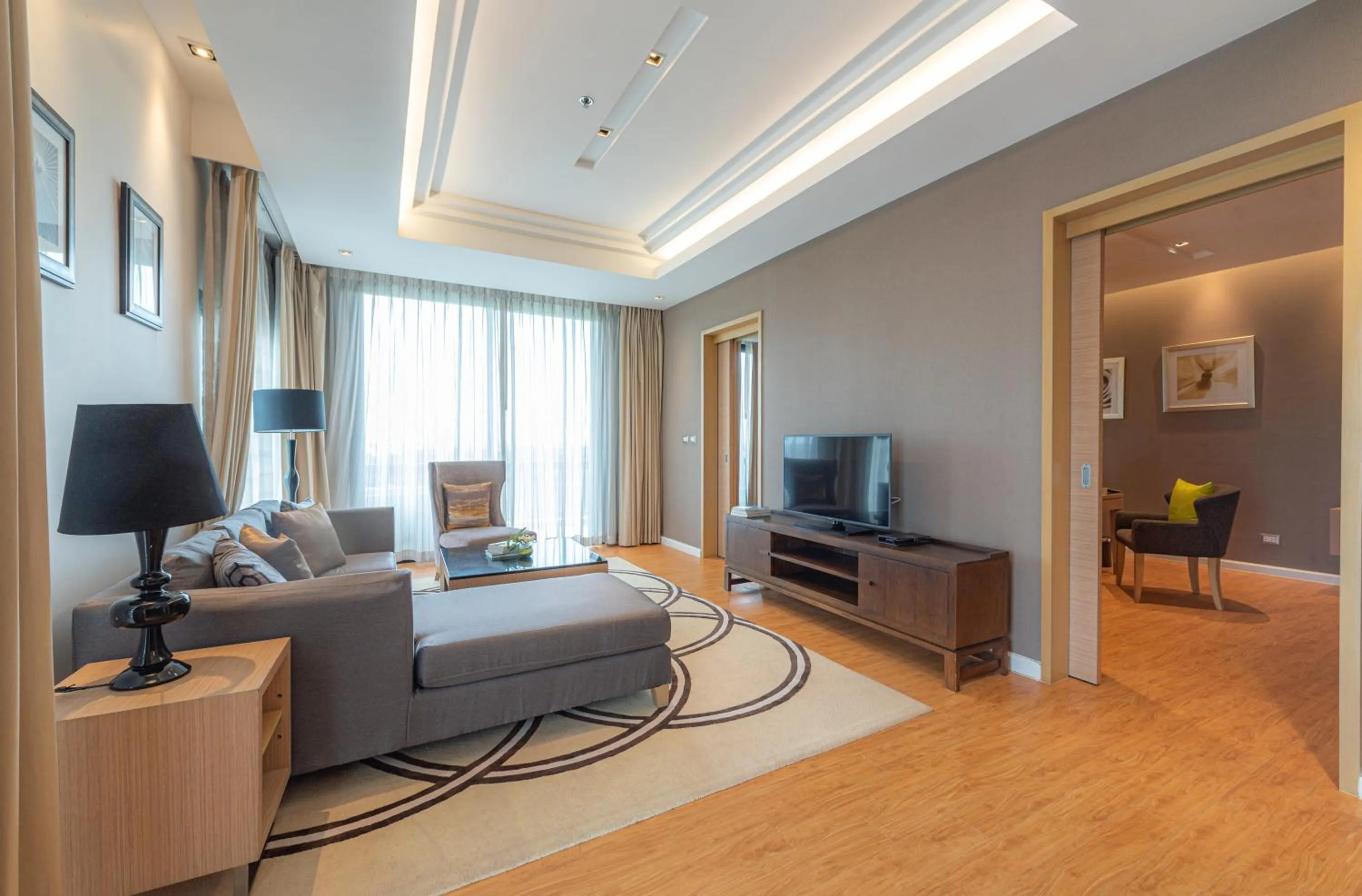 Living room in Summit Windmill Golf Suite Hotel at Suvarnabhumi
