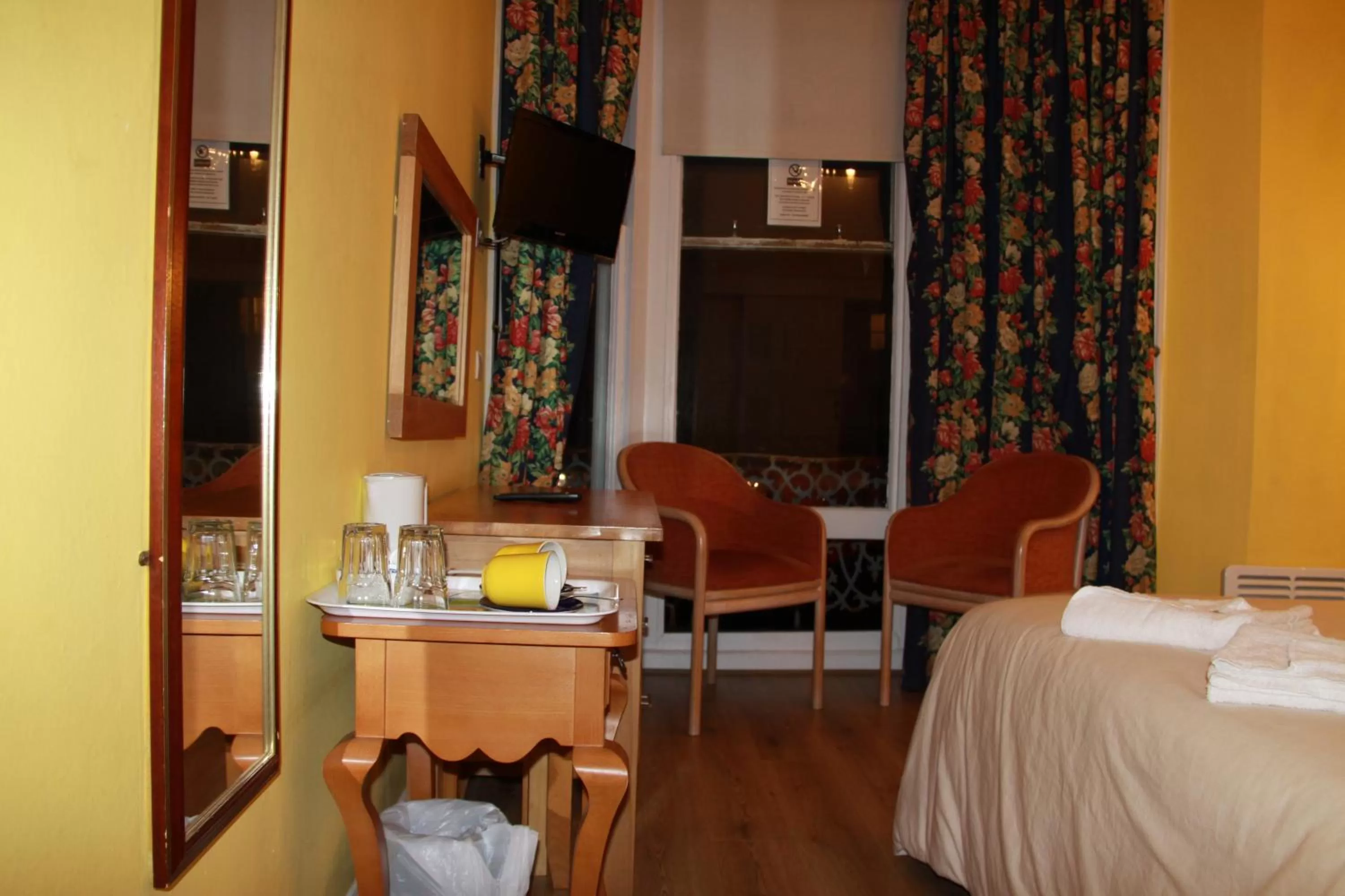 Bed in Ambassador Hotel