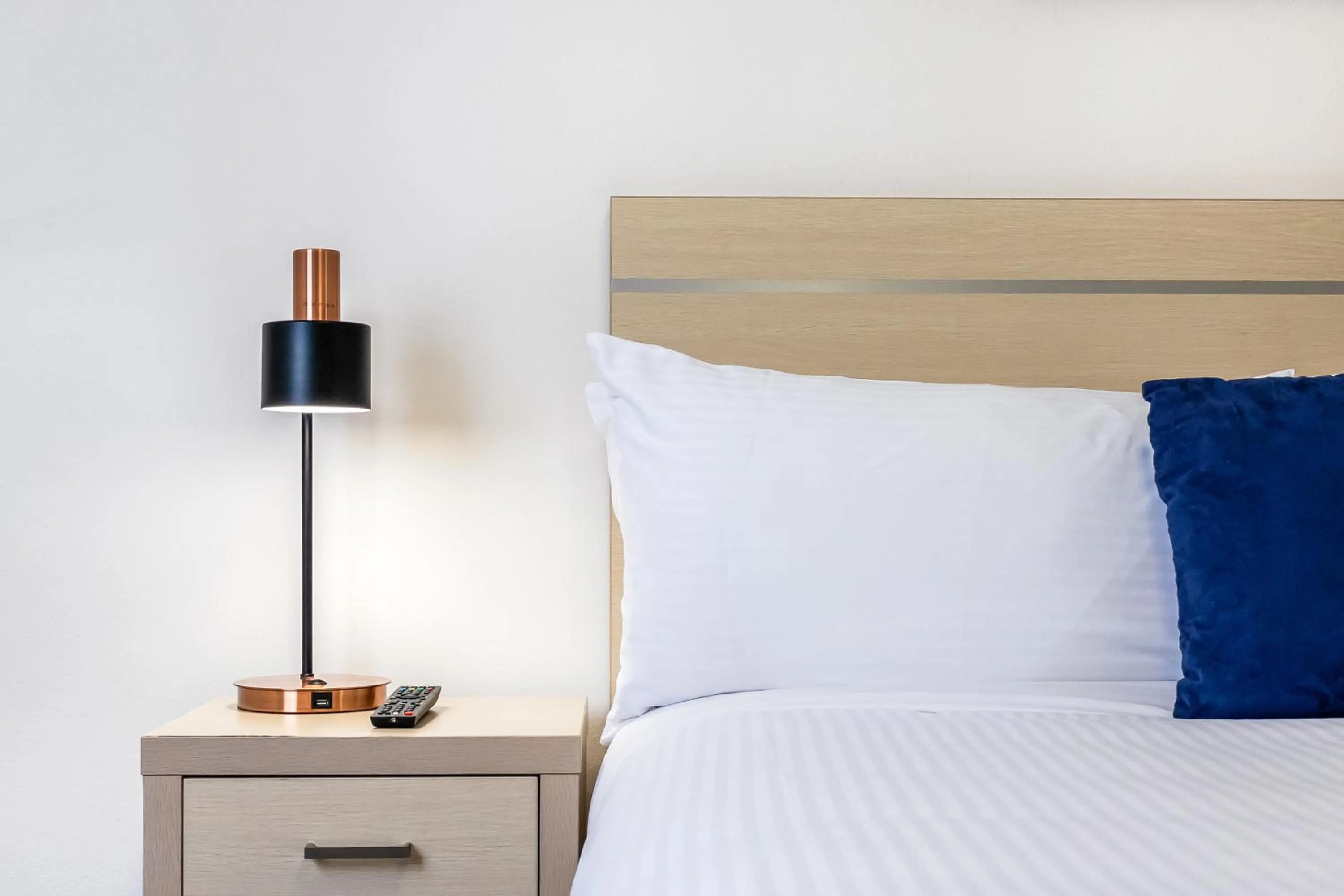 Bed in Oaks Sydney Castlereagh Suites