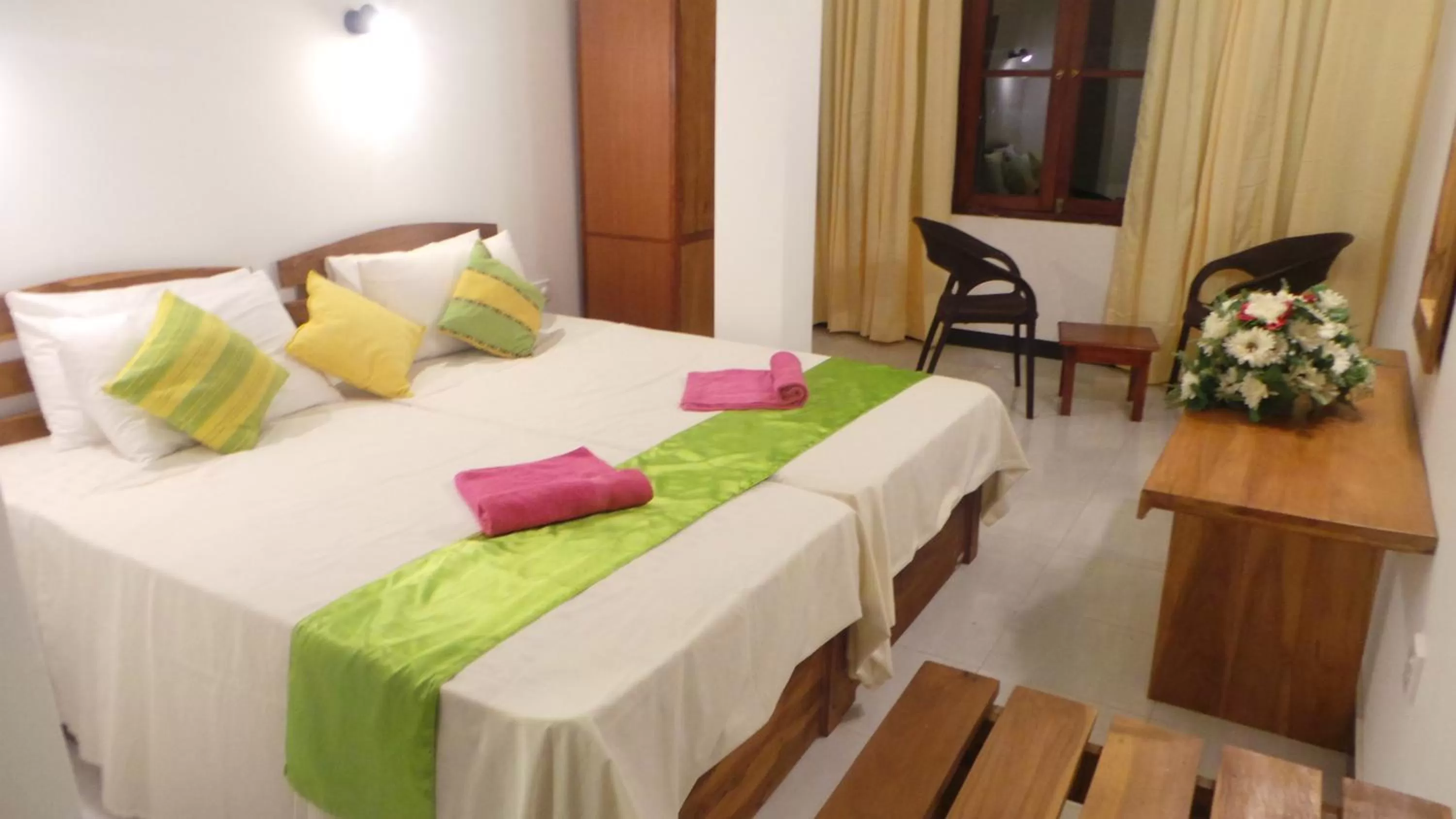 Bed in WindMill Beach Villa and Hotel