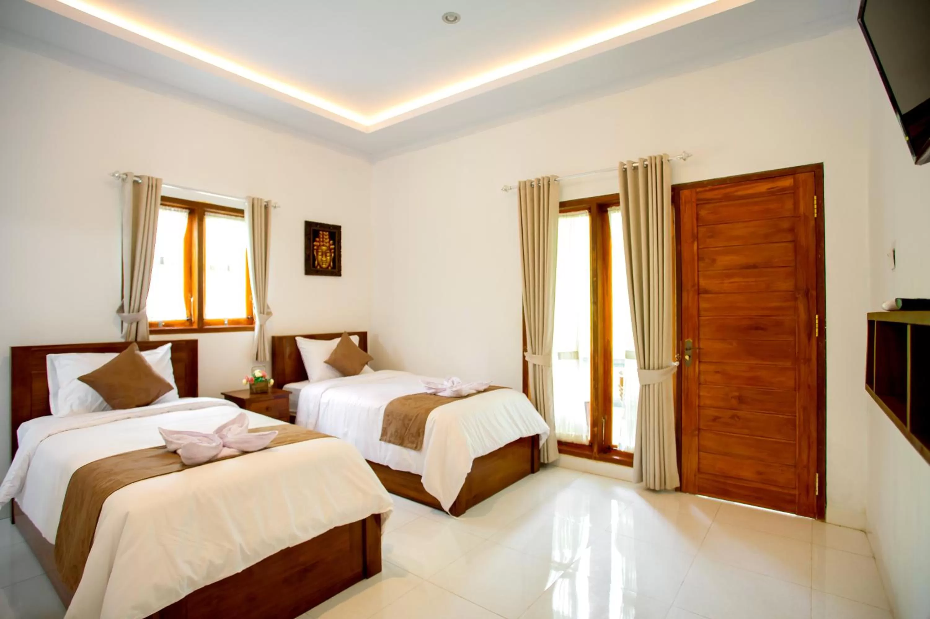 Bed in The Puncak Santhi Inn